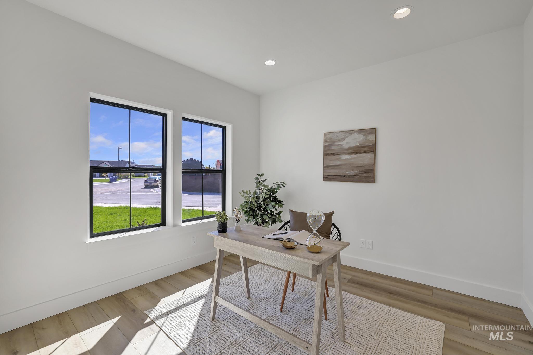 Office featuring recessed lighting and light wood-style flooring