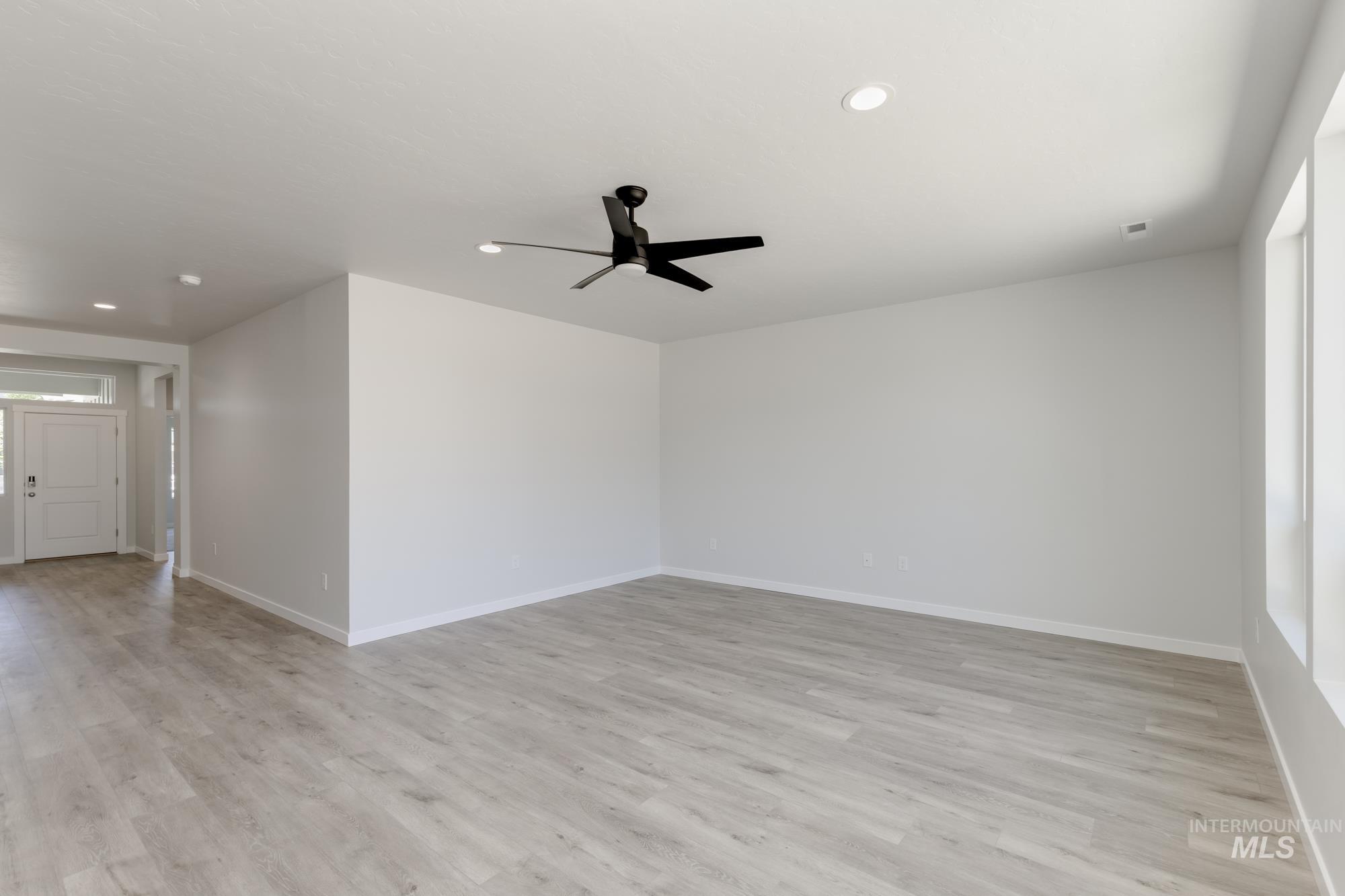 Unfurnished room with ceiling fan, recessed lighting, and light wood-style flooring