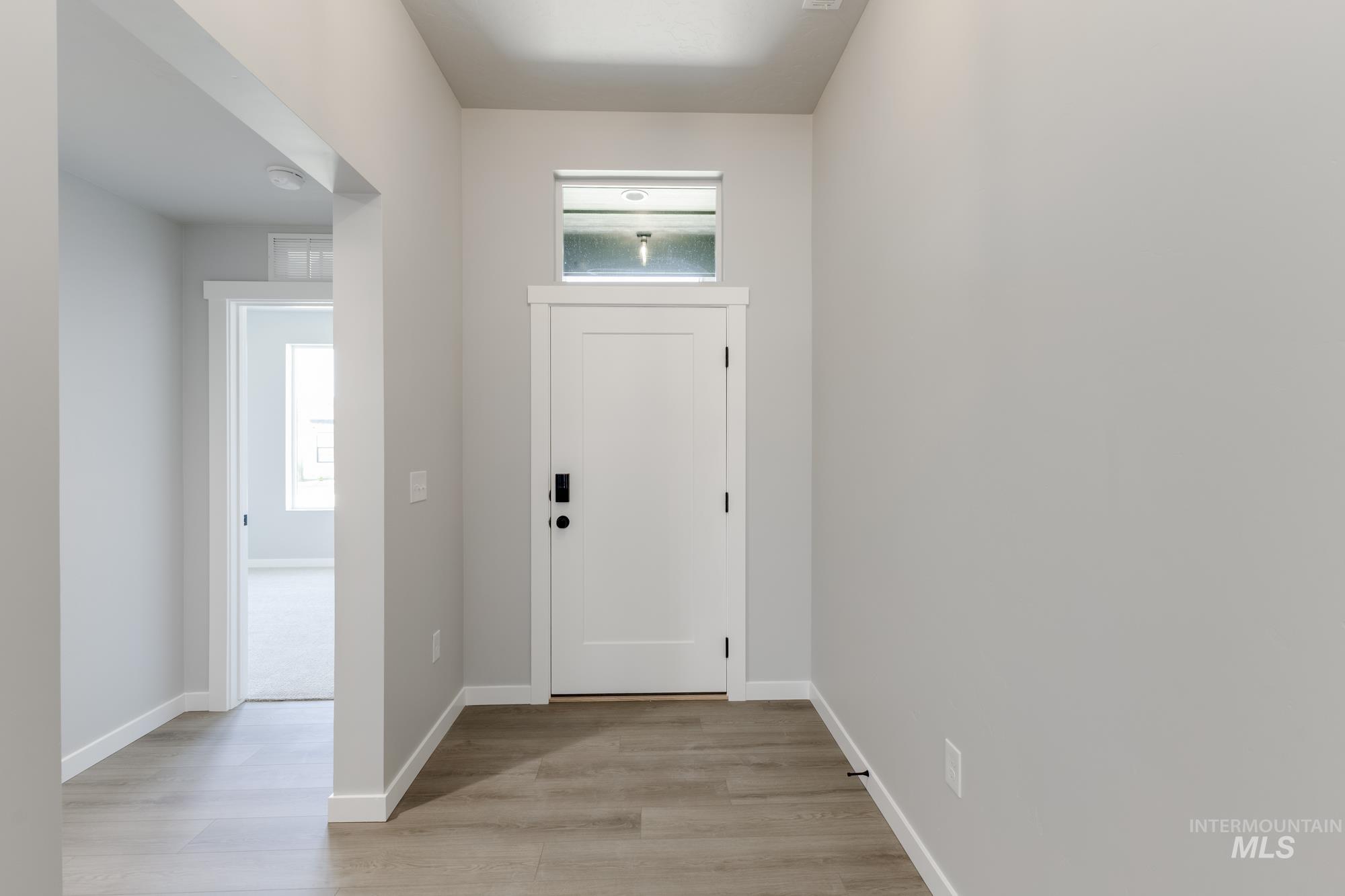 Foyer featuring light wood-style floors