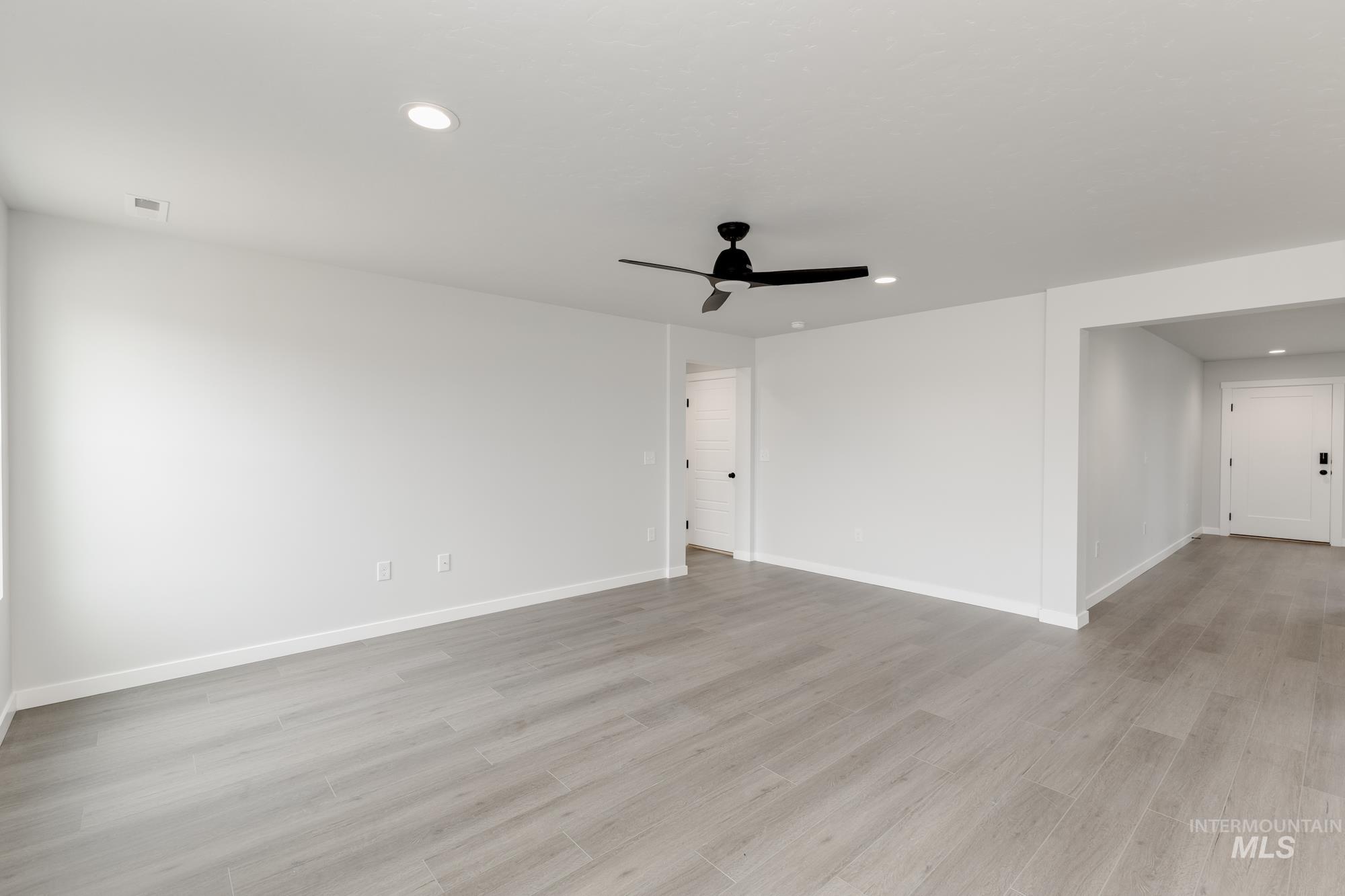 Spare room featuring recessed lighting, ceiling fan, and light wood finished floors