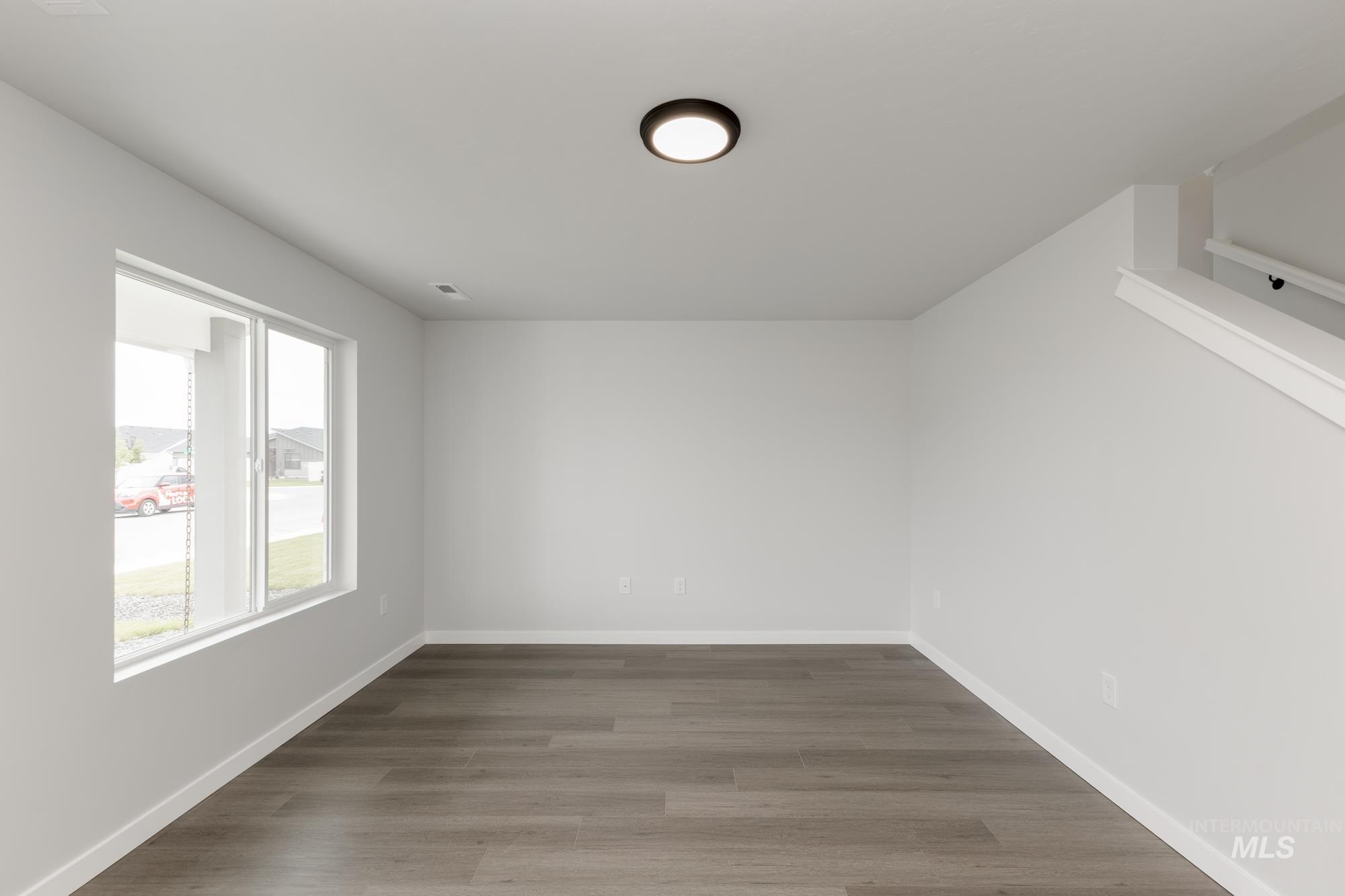Empty room featuring wood finished floors