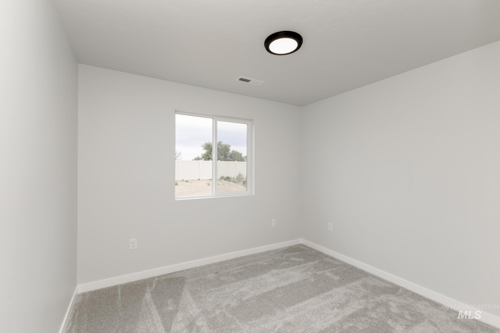 Spare room with carpet floors