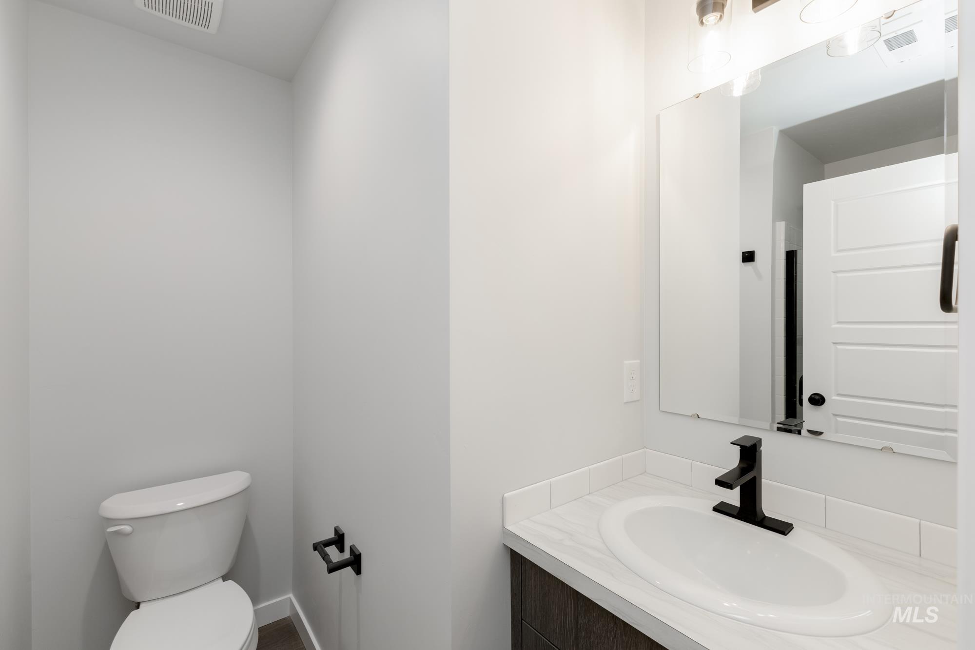 Bathroom with vanity and toilet