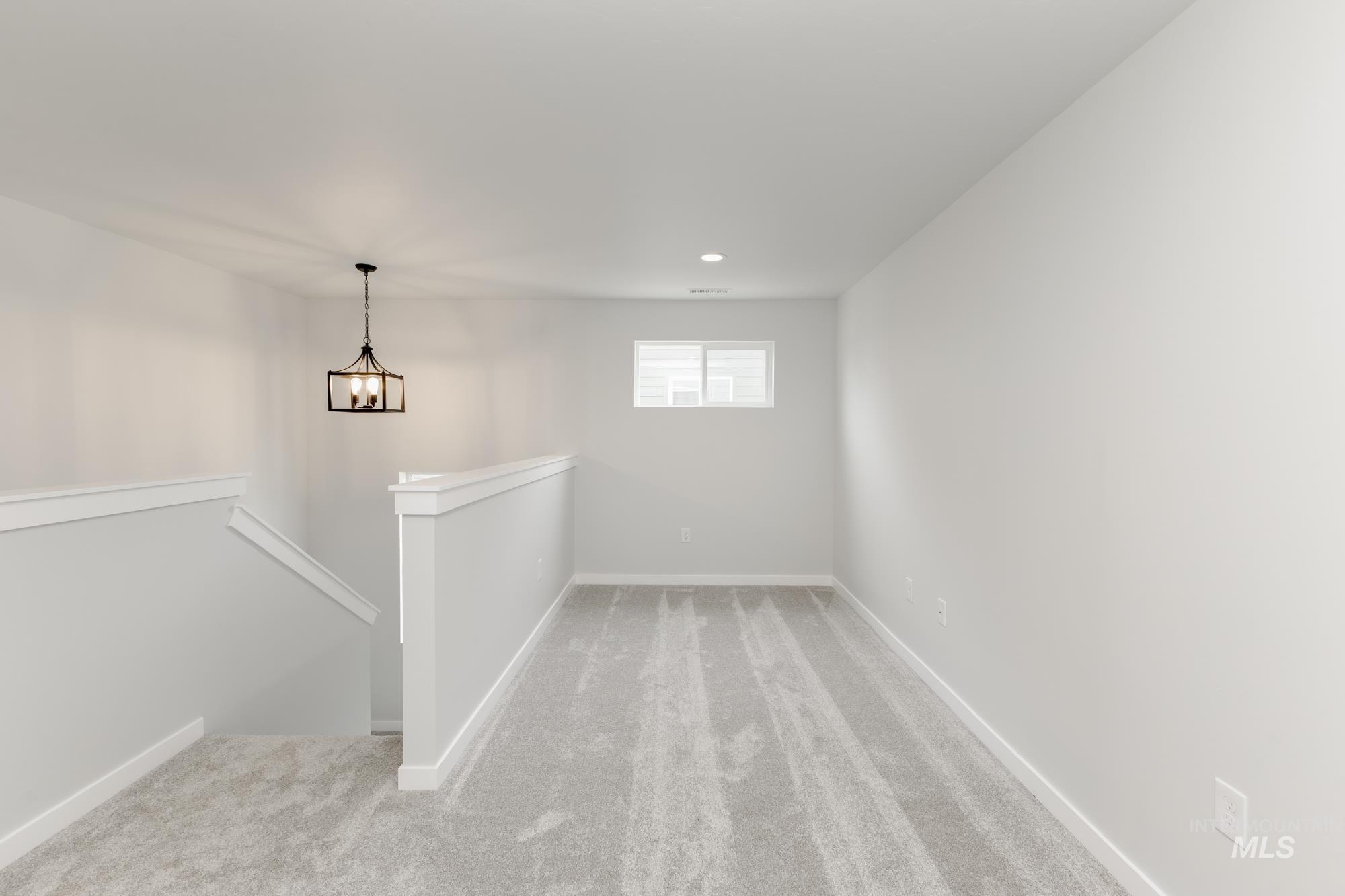 Empty room featuring carpet flooring and recessed lighting