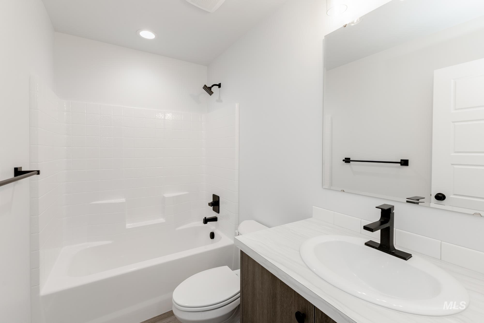 Full bathroom with vanity and  shower combination