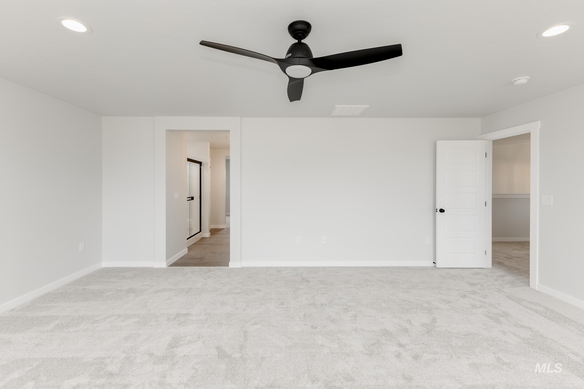Unfurnished room featuring a ceiling fan, carpet, and recessed lighting