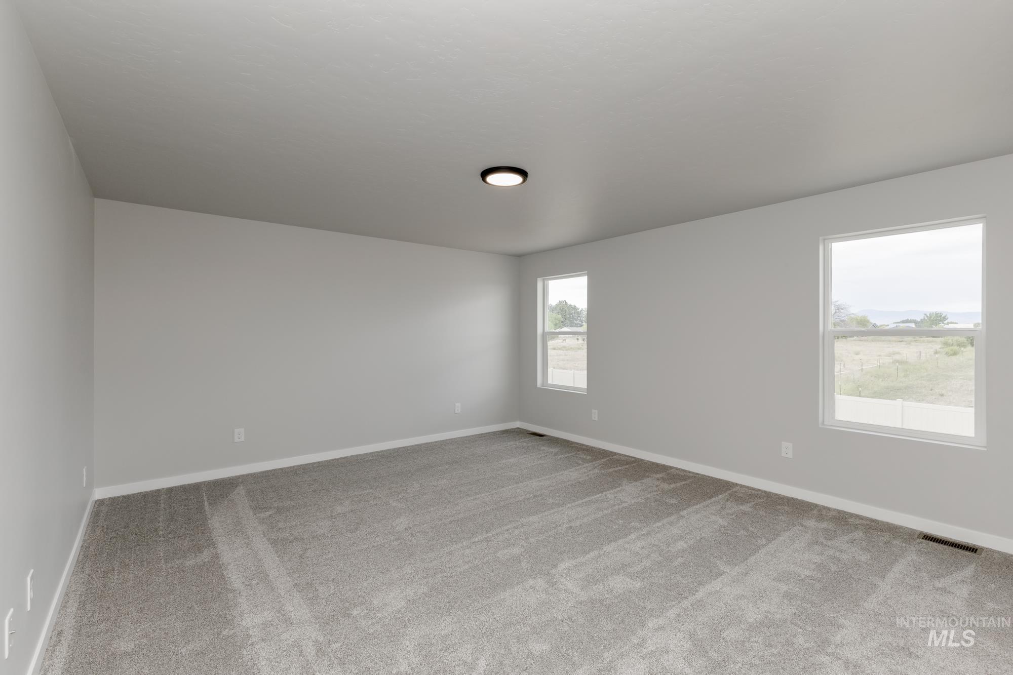 Empty room featuring carpet flooring