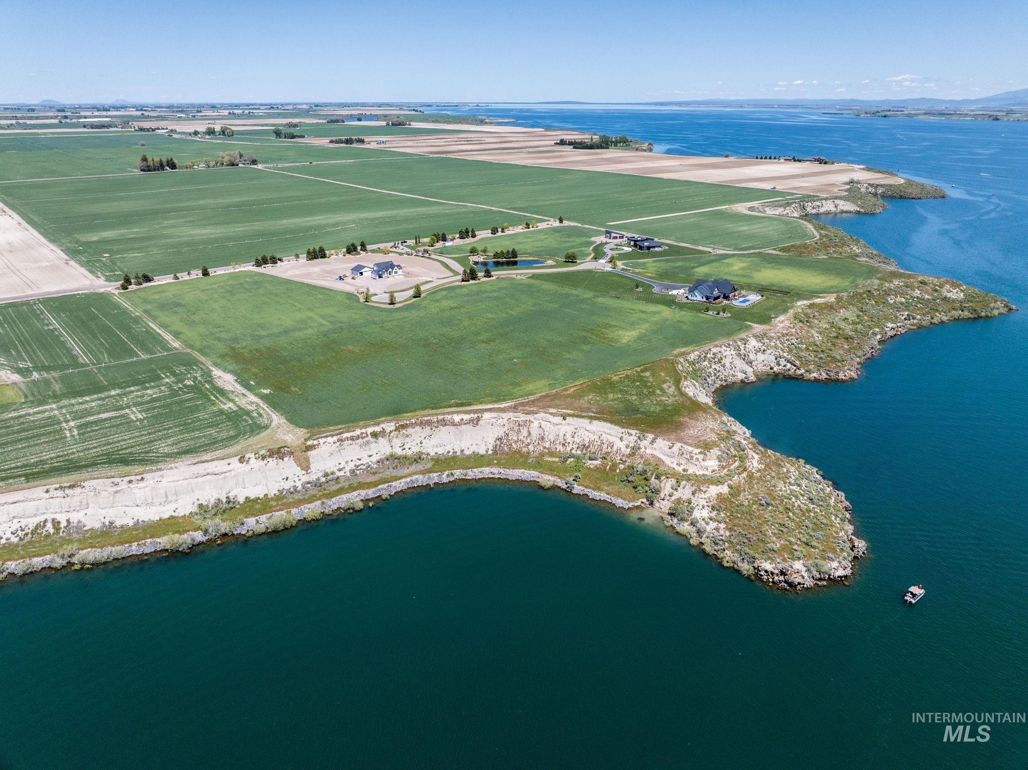 Aerial view of property's location featuring a large body of water