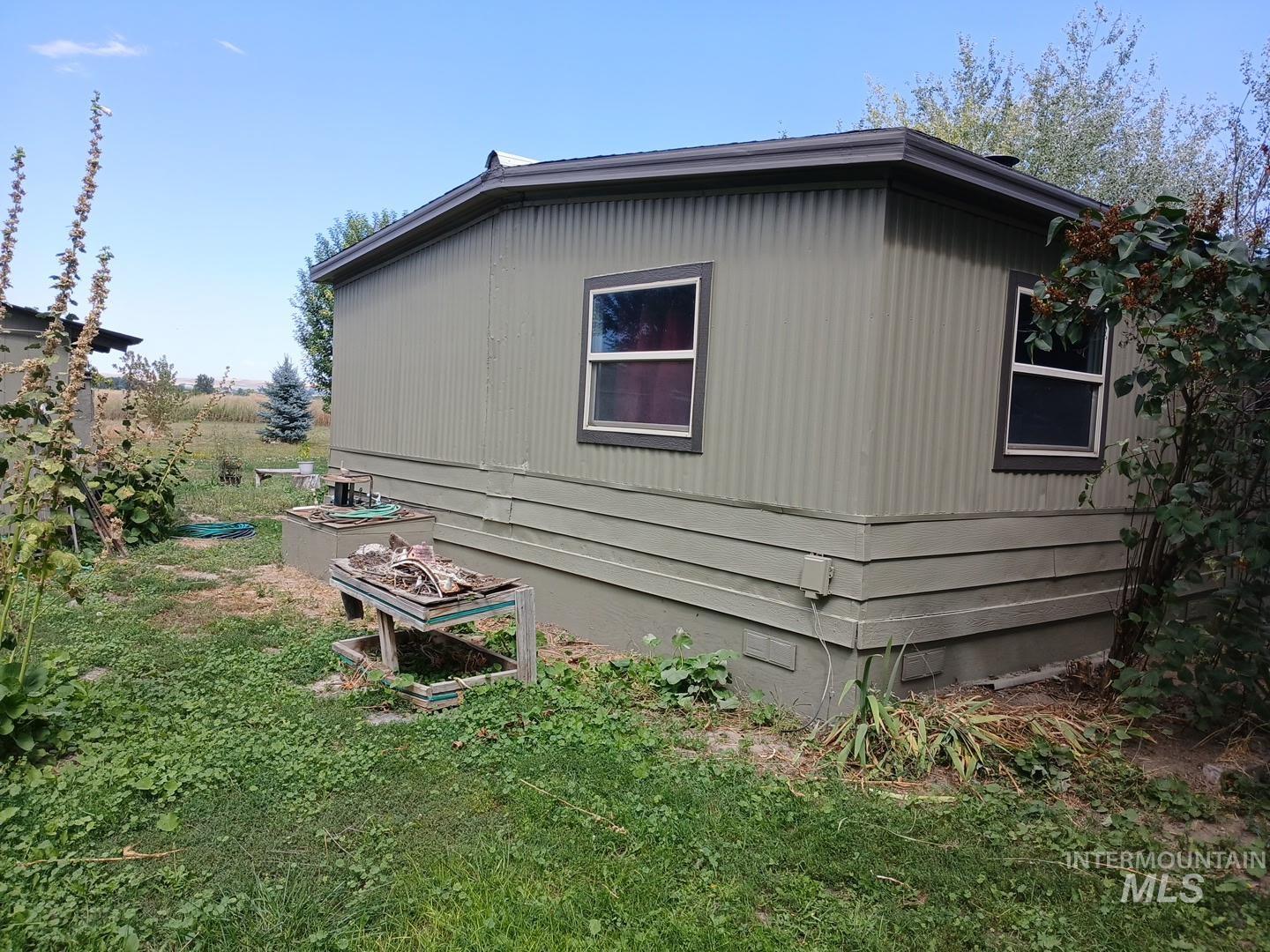 View of side of property with crawl space