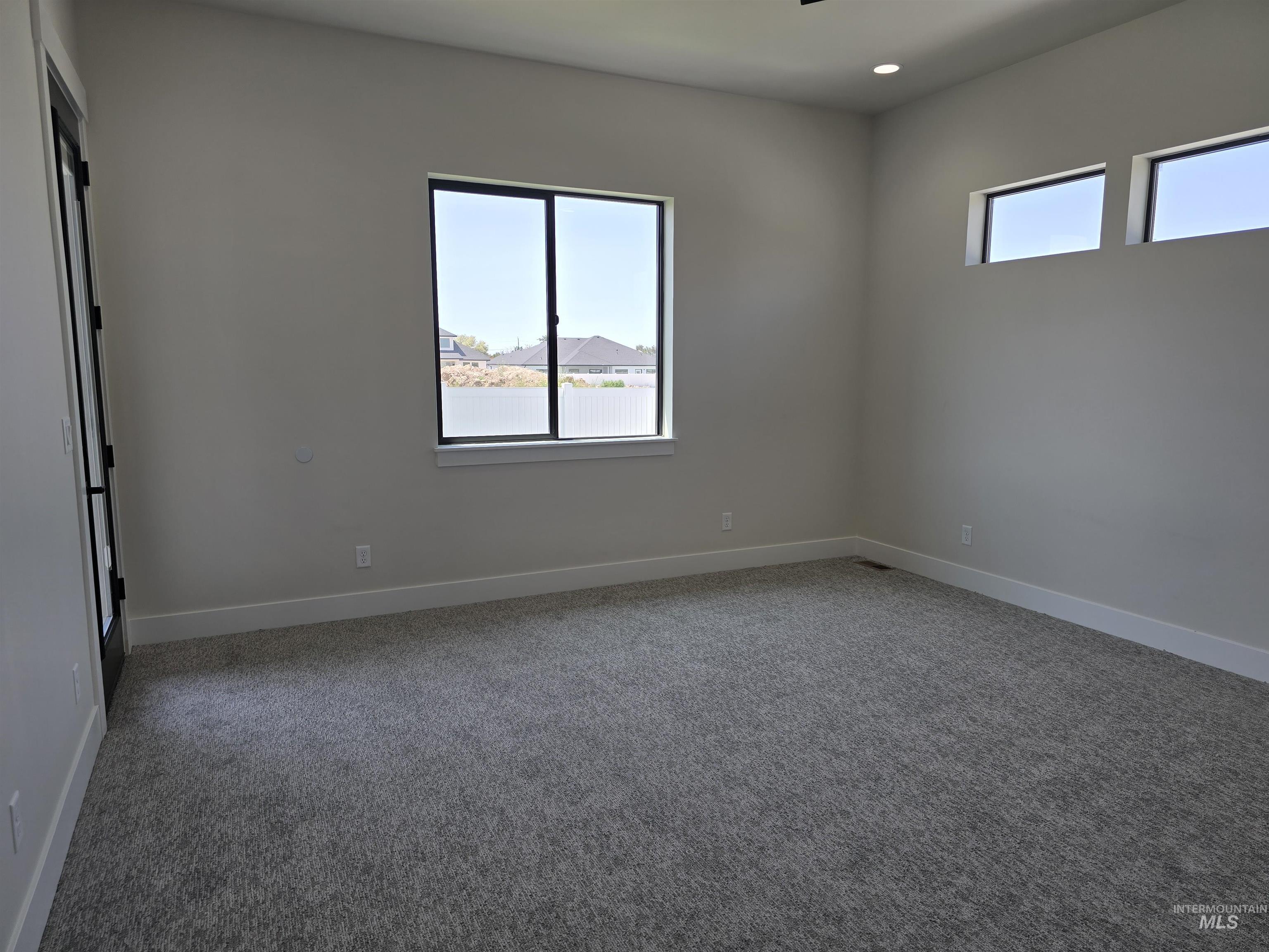 Unfurnished room featuring carpet floors and recessed lighting