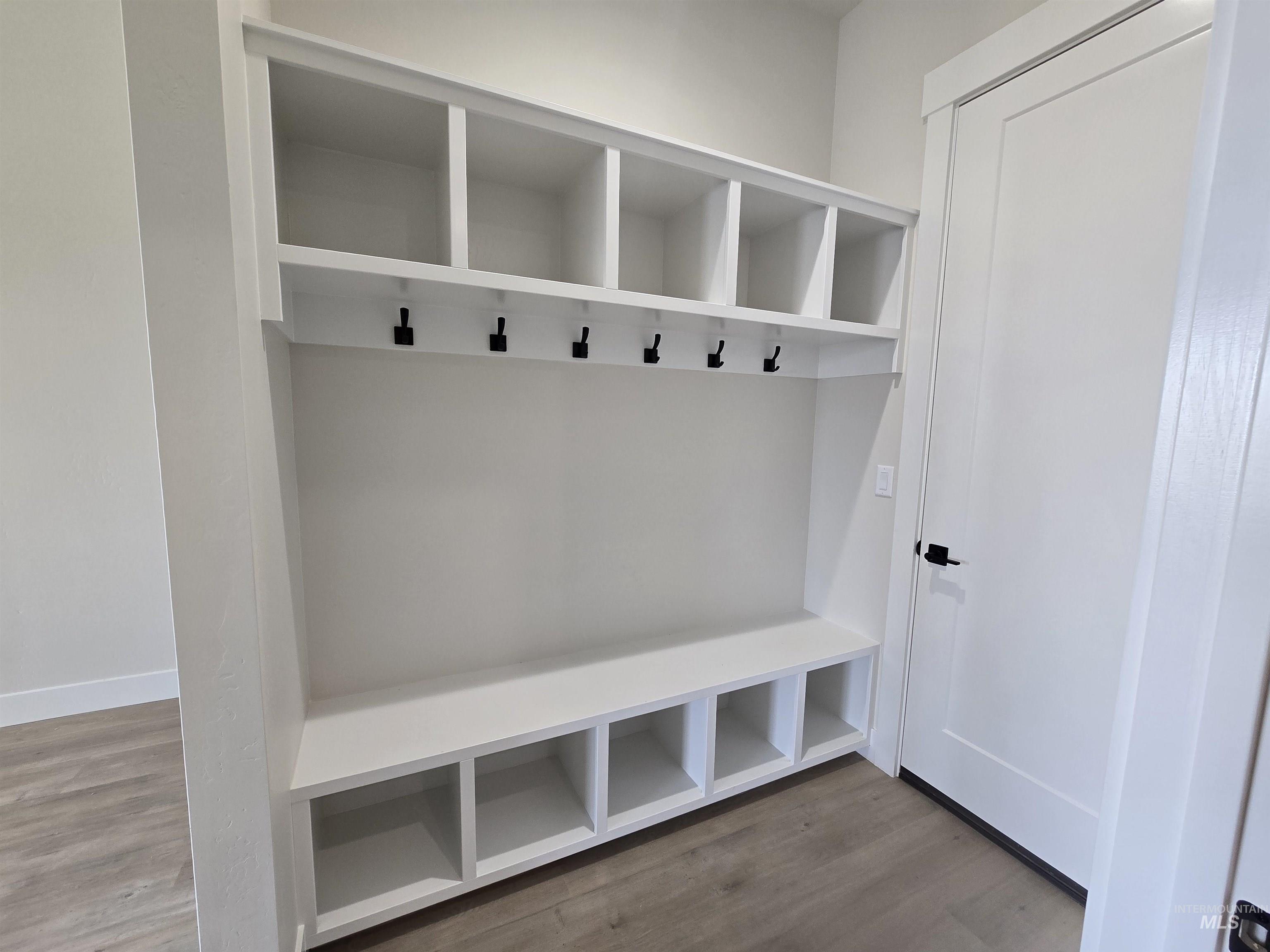 Mudroom featuring wood finished floors