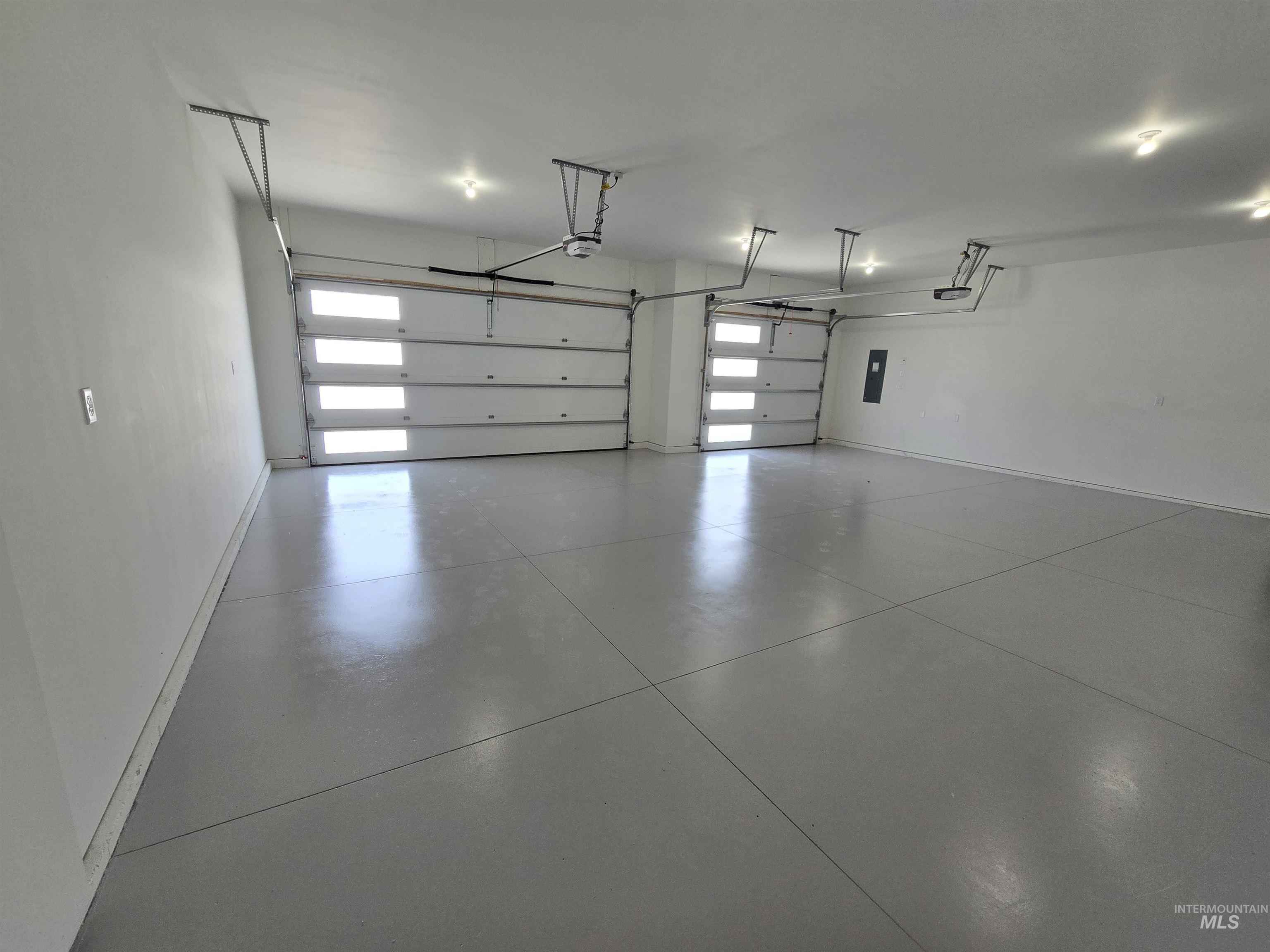 Garage with a garage door opener and electric panel