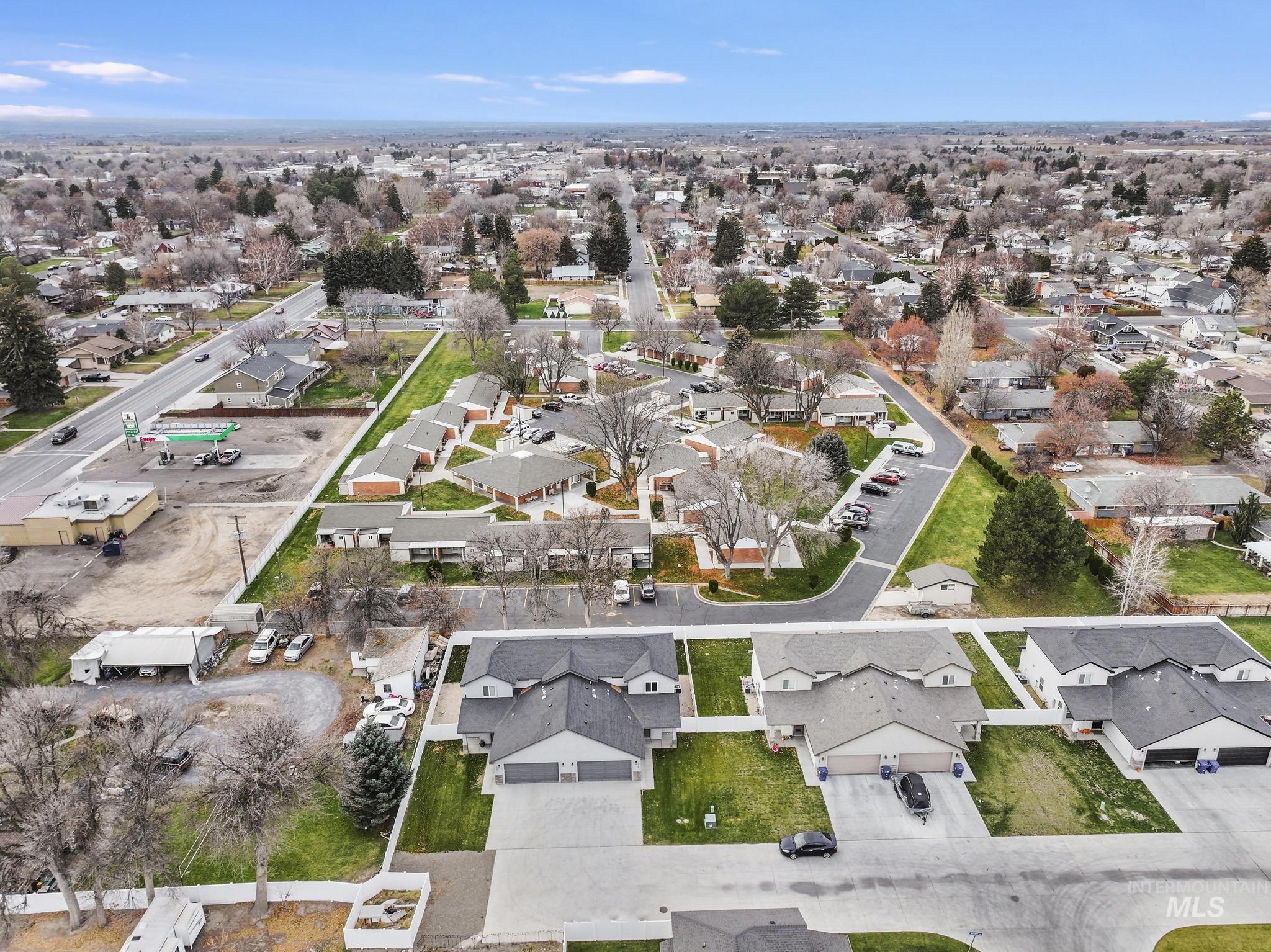 Aerial overview of property's location featuring nearby suburban area