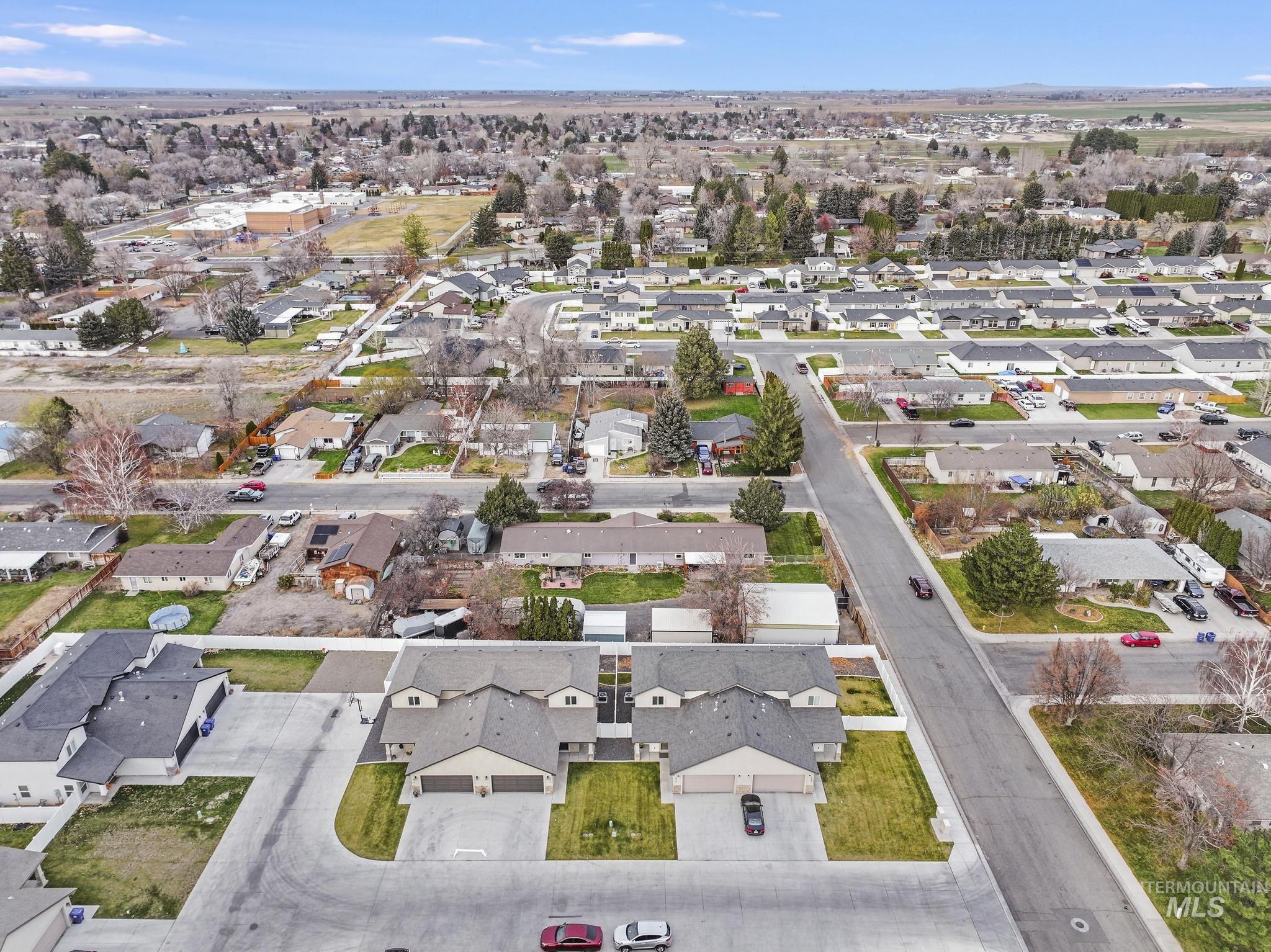 Aerial overview of property's location featuring nearby suburban area