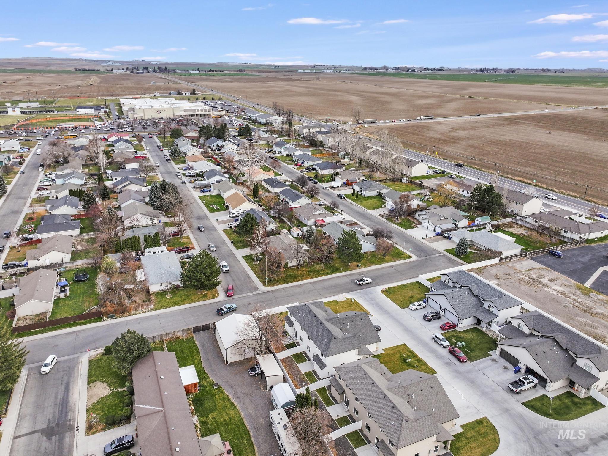Aerial overview of property's location with nearby suburban area
