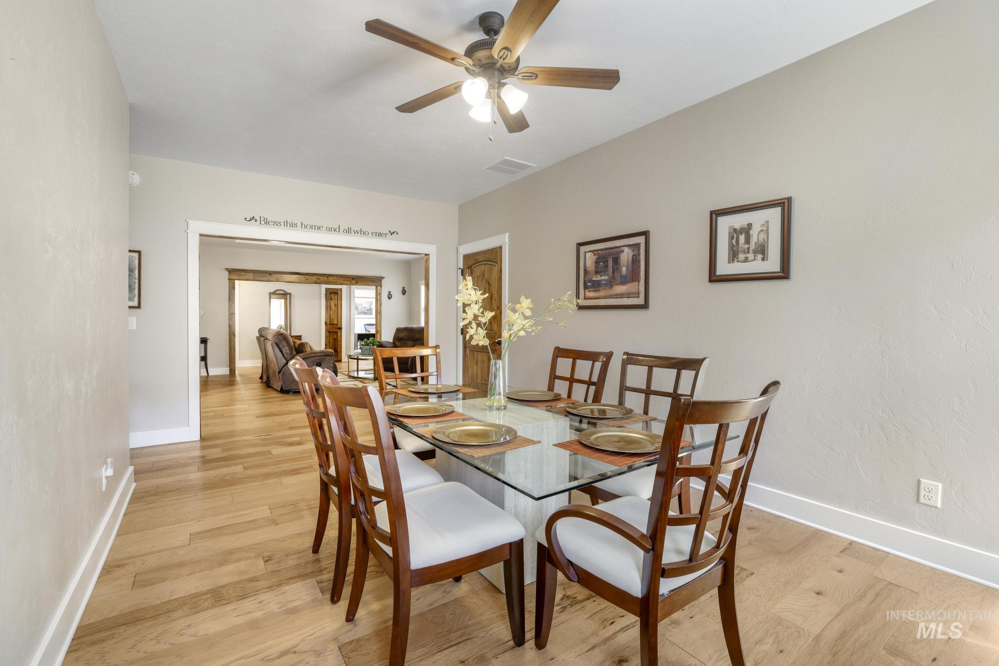 Dining room featuring light wood-style floors and a ceiling fan