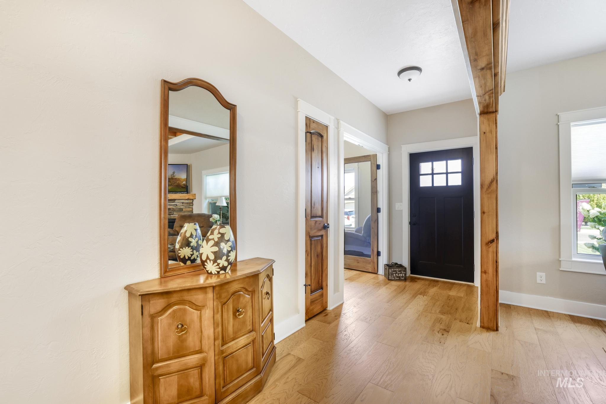 Entryway featuring light wood finished floors and baseboards