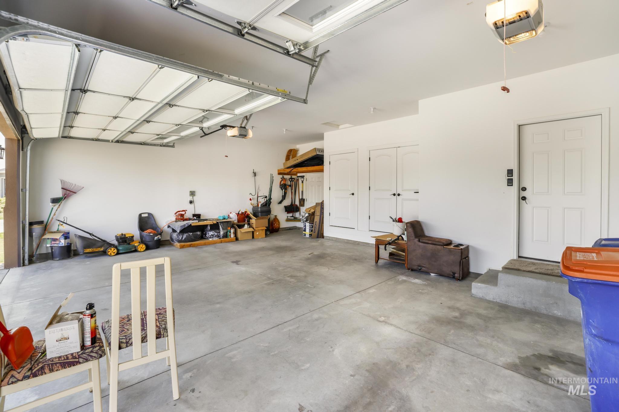 Garage featuring a garage door opener