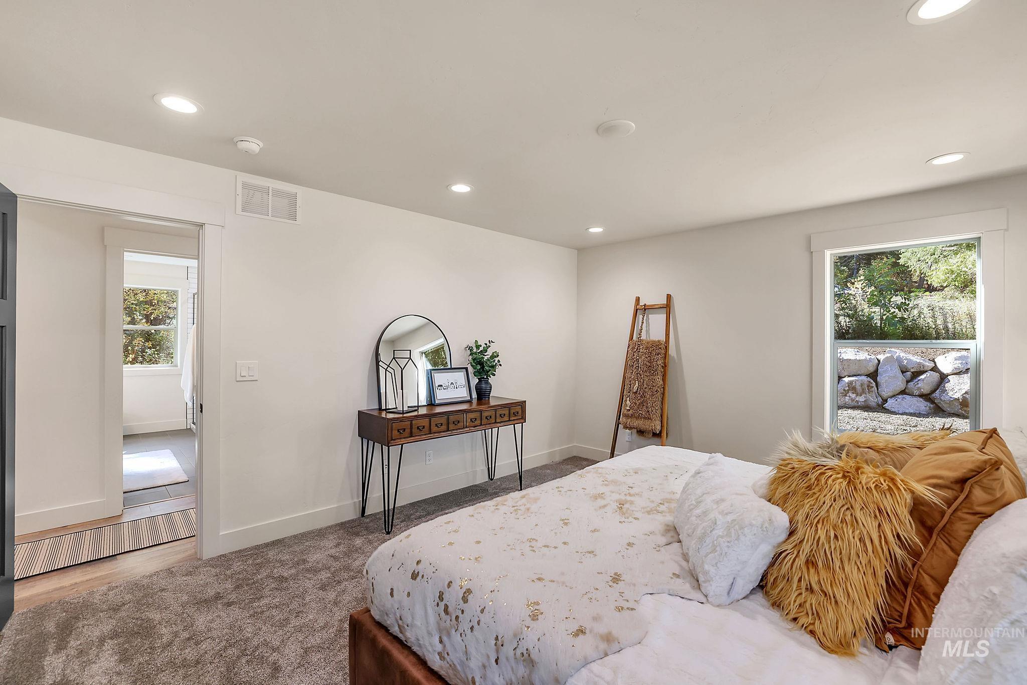 Bedroom with recessed lighting and carpet floors