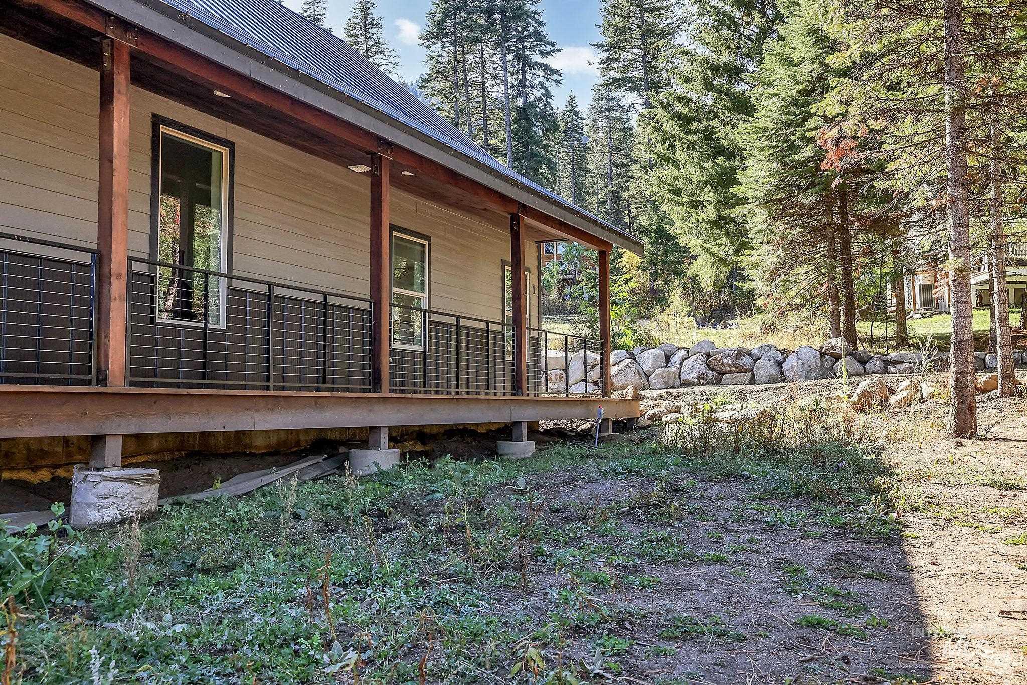View of property exterior featuring a porch
