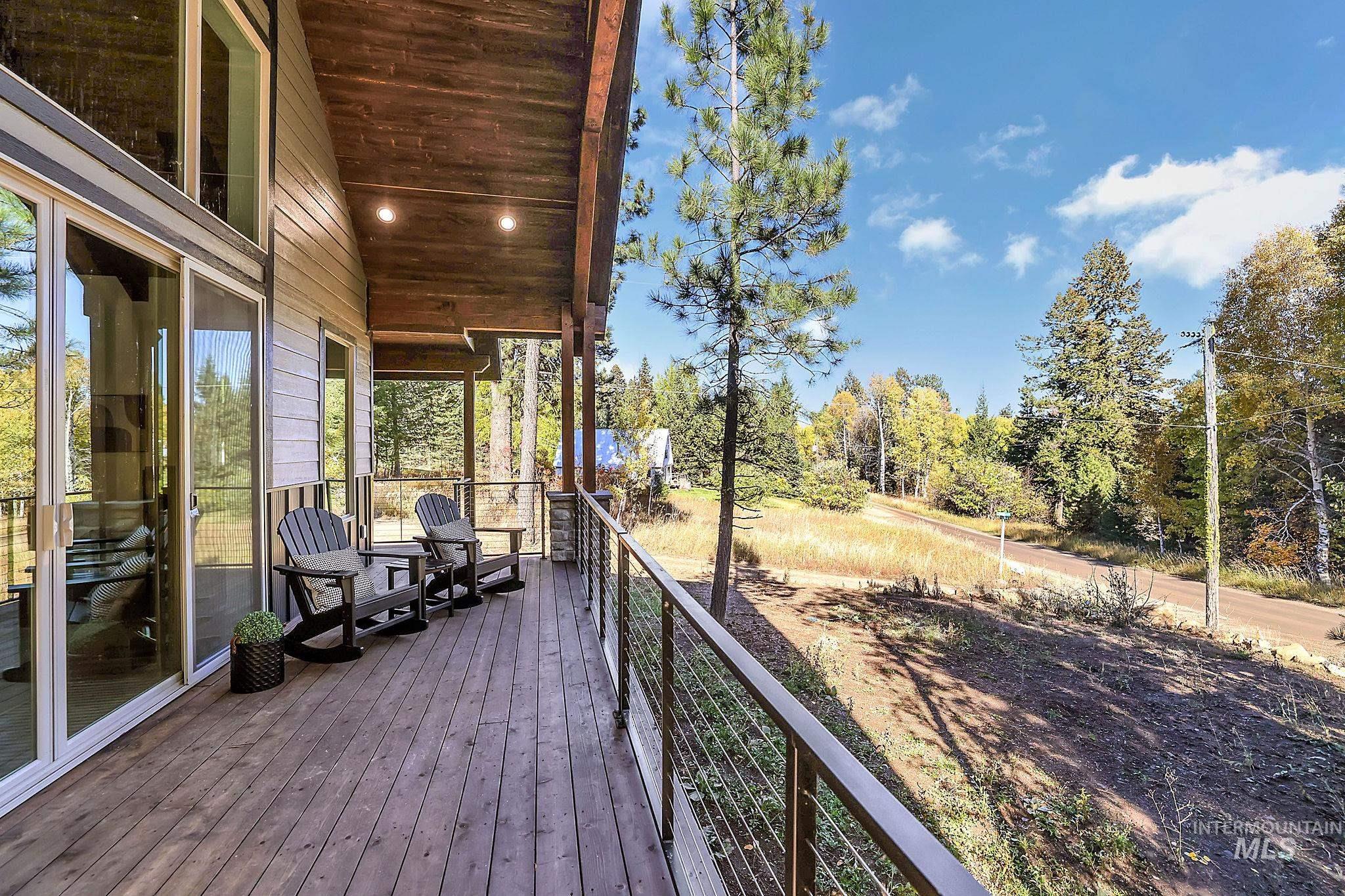Wooden terrace with view of scattered trees