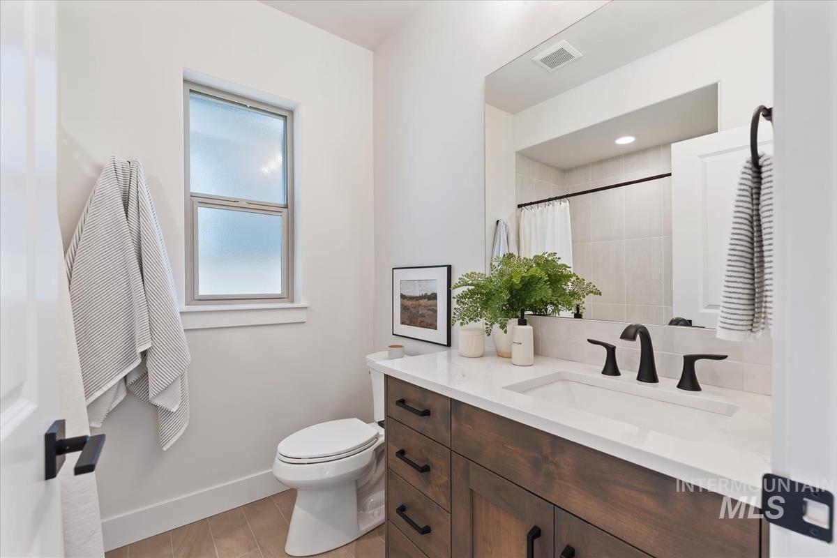 Bathroom featuring vanity and a shower with shower curtain
