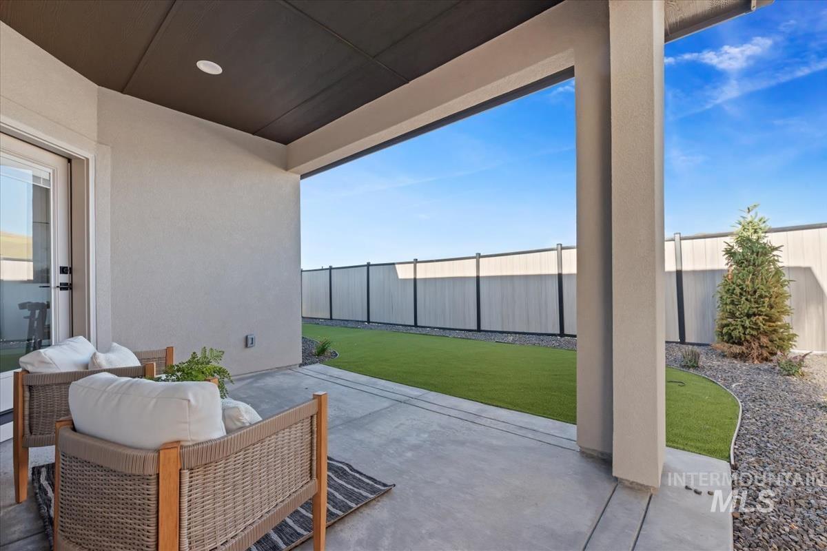 Fenced backyard with a patio area
