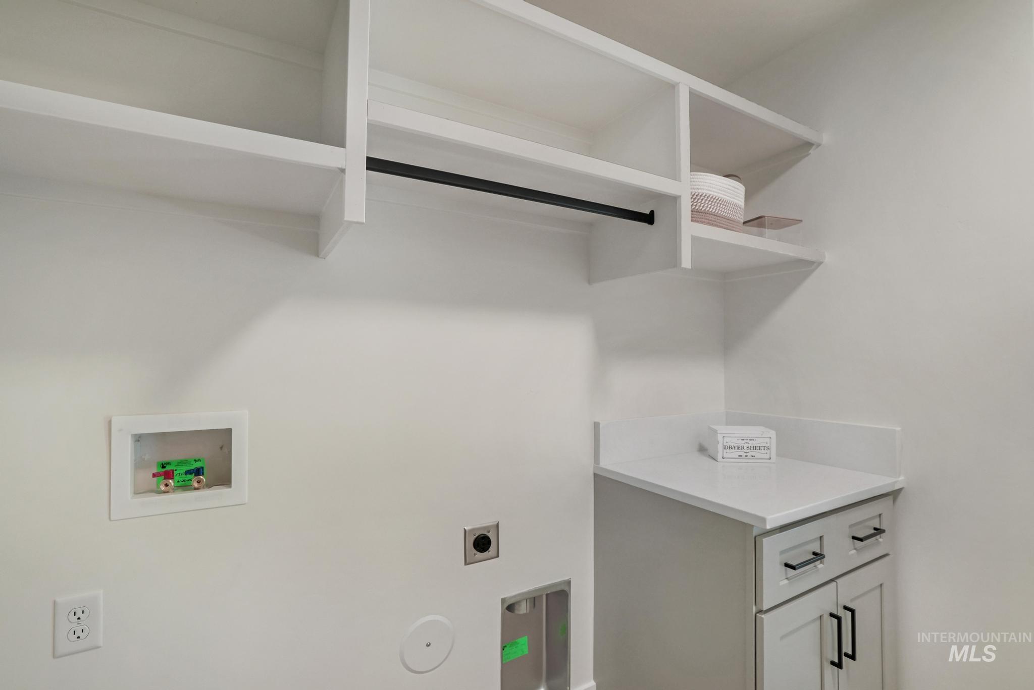 Laundry room with electric dryer hookup and hookup for a washing machine