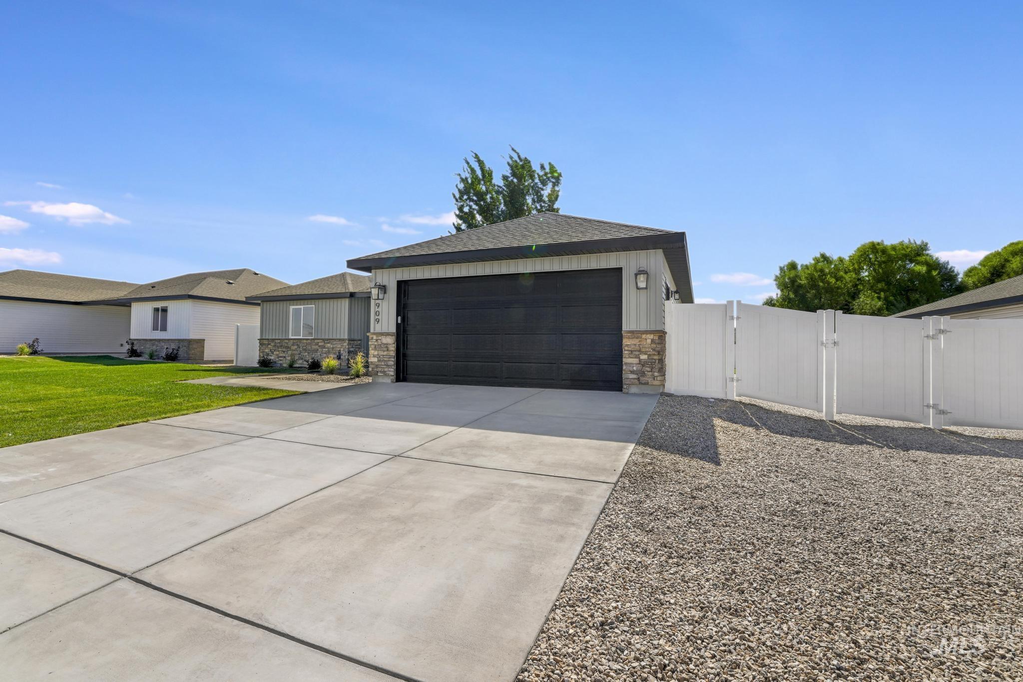 View of front of property featuring a gate, and RV Parking.