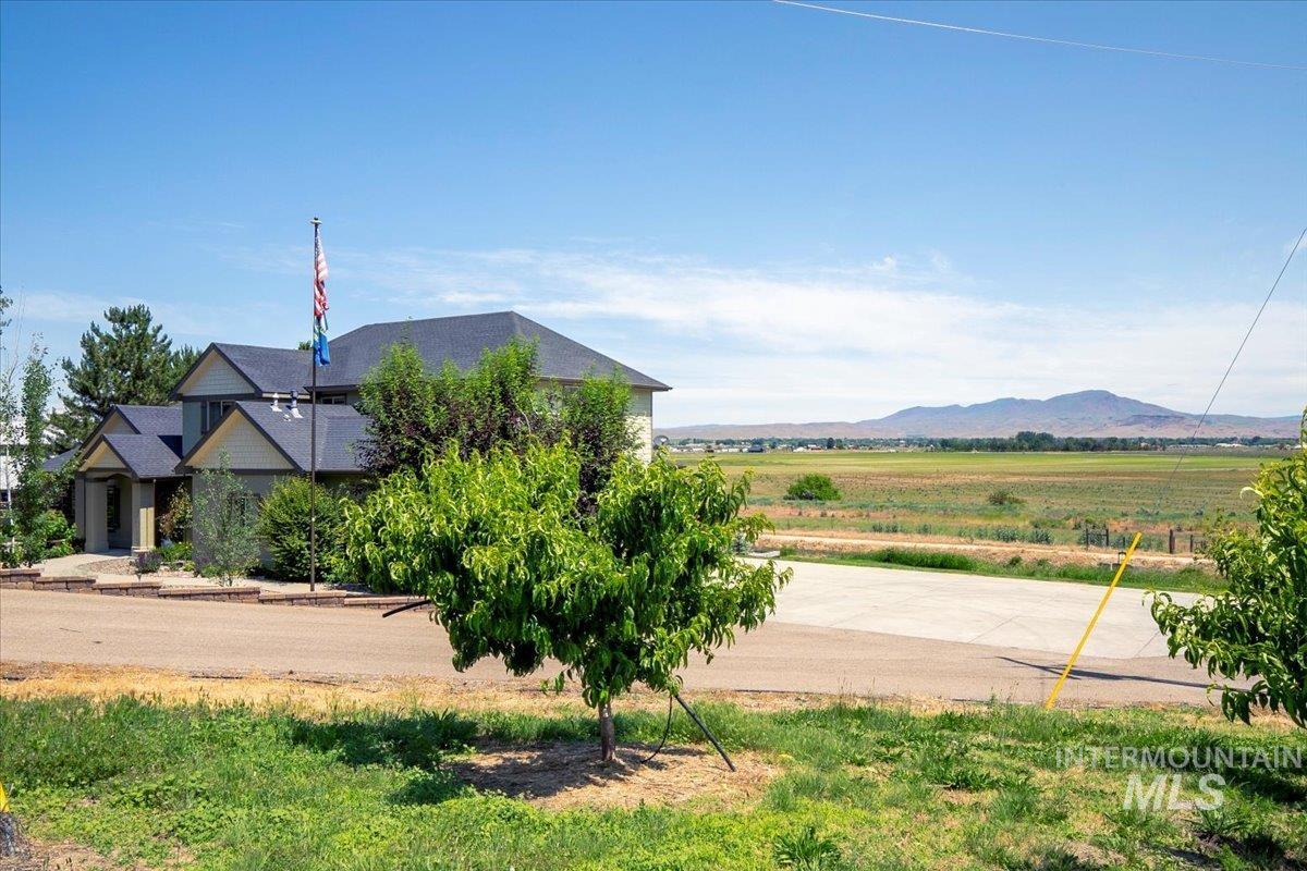 View of mountain backdrop with rural landscape