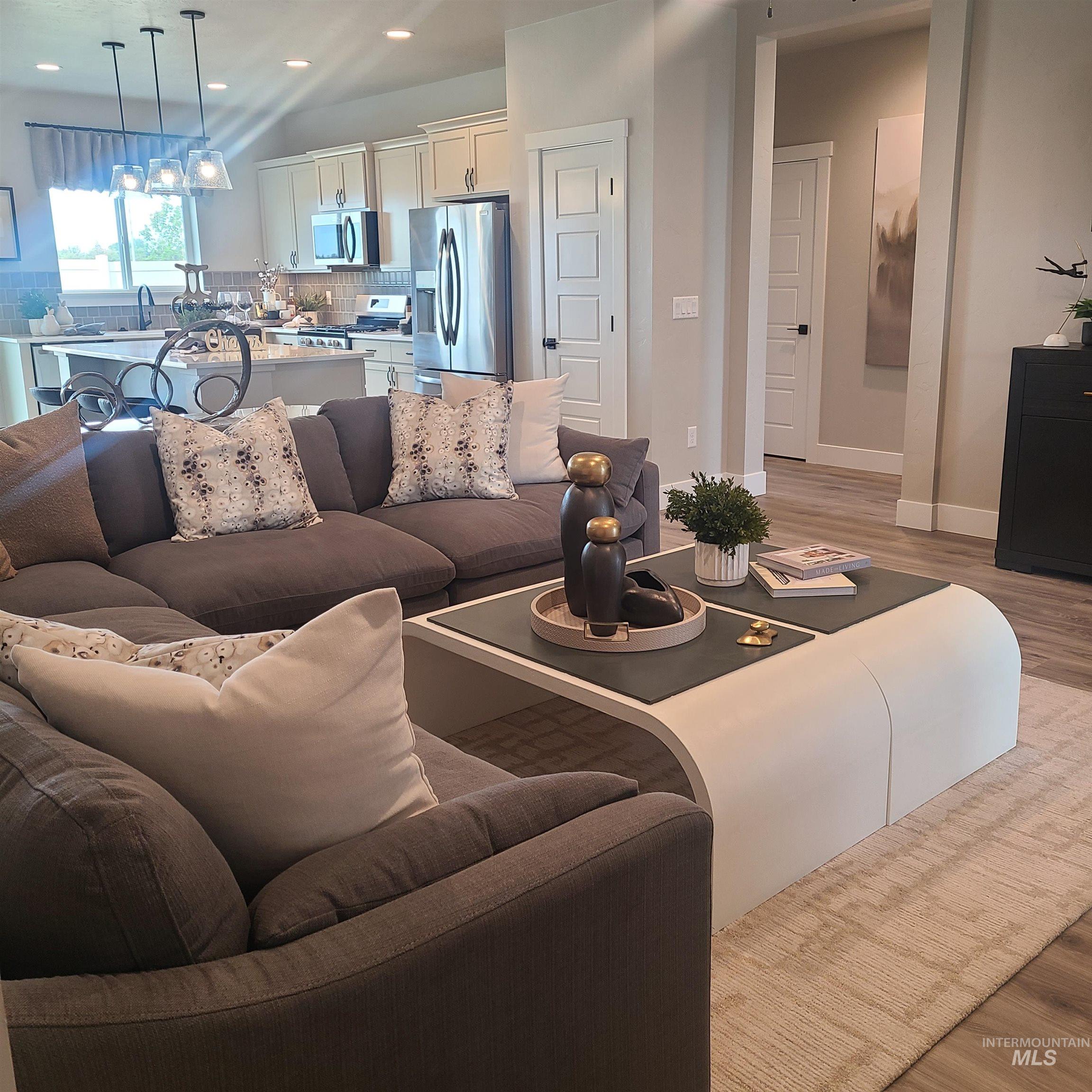 Living room featuring light wood-type flooring and recessed lighting
