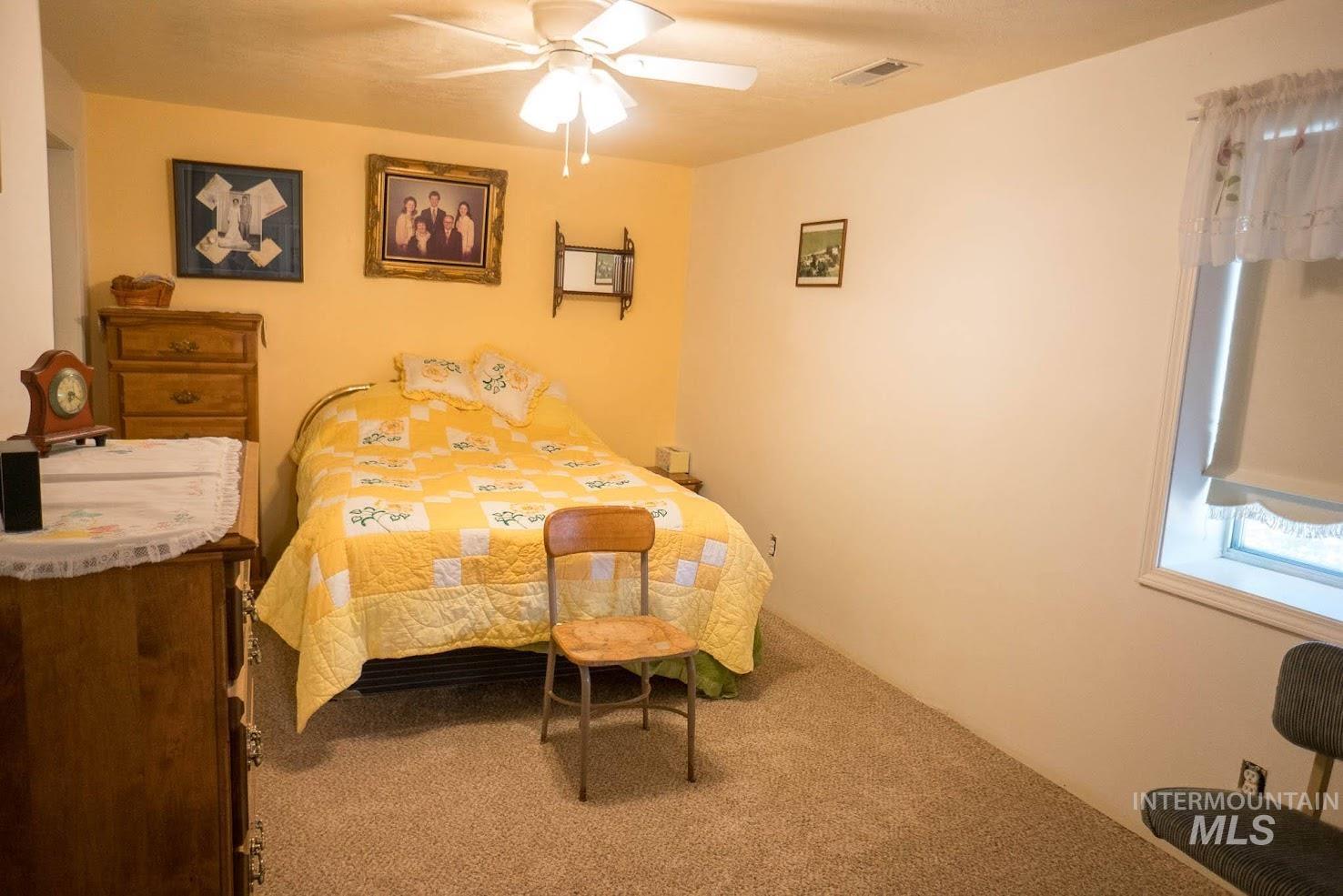 Bedroom with carpet floors and ceiling fan