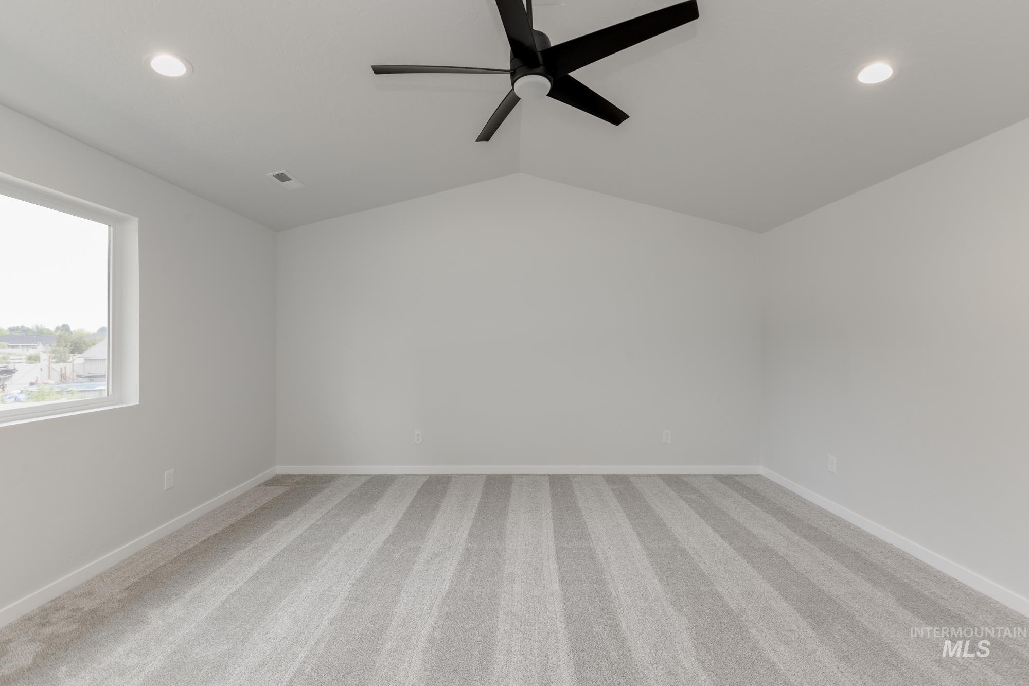 Bonus room with ceiling fan, recessed lighting, light colored carpet, and vaulted ceiling