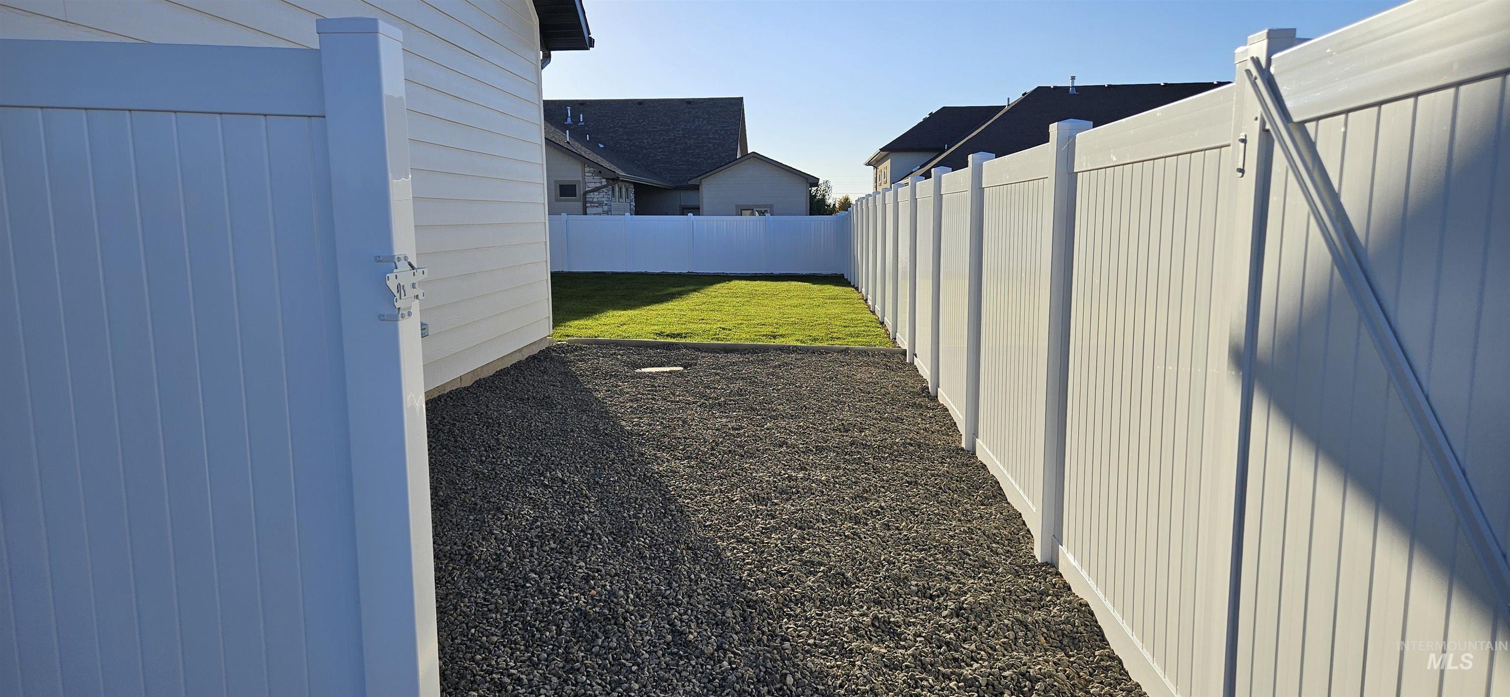 View of fenced backyard