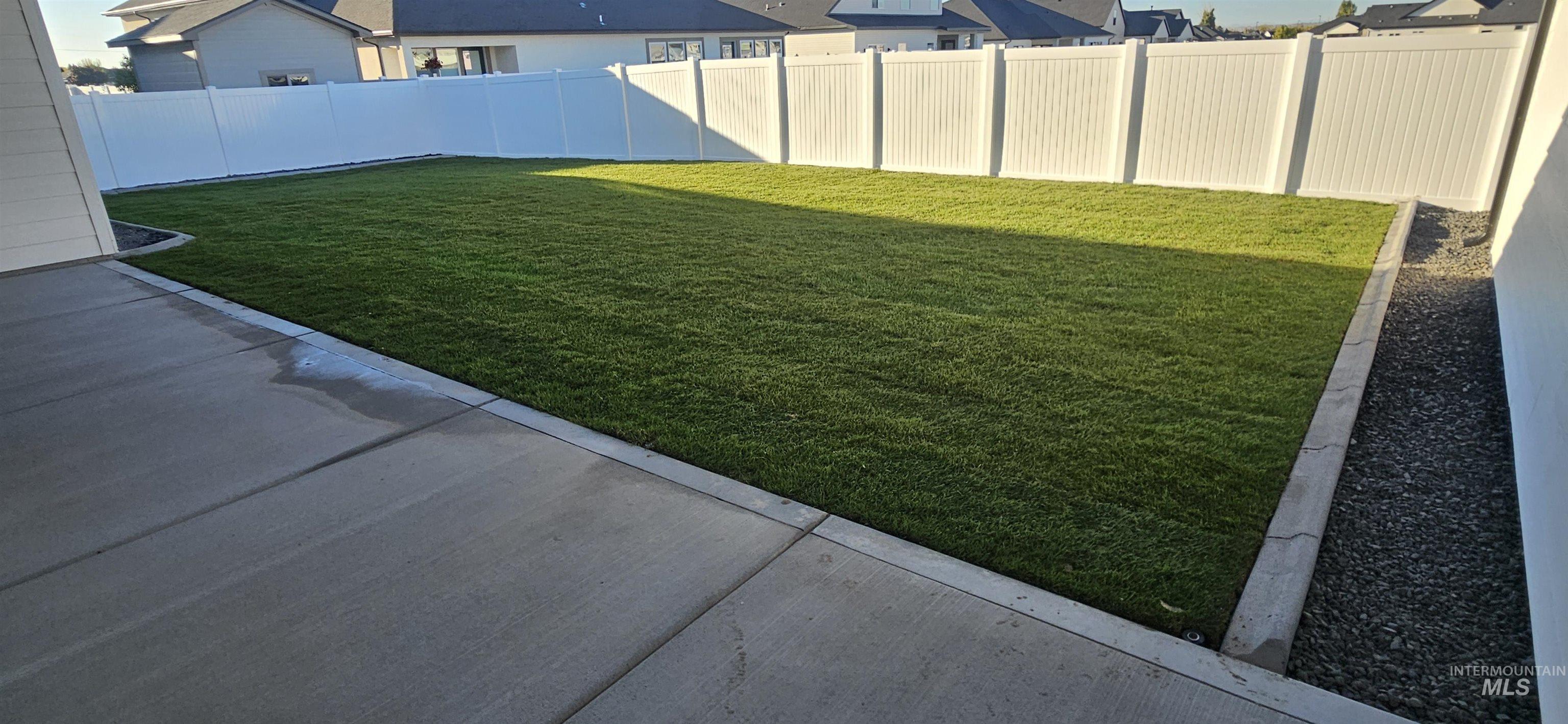 Fenced backyard featuring a patio area