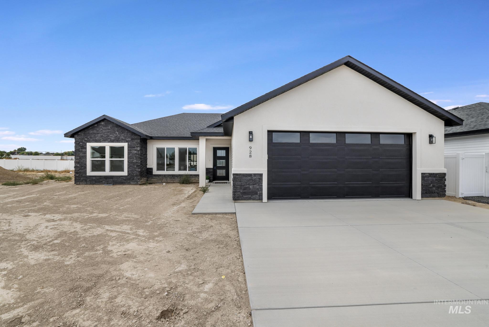 View of front facade with stone siding, stucco siding, driveway, a shingled roof, and a garage