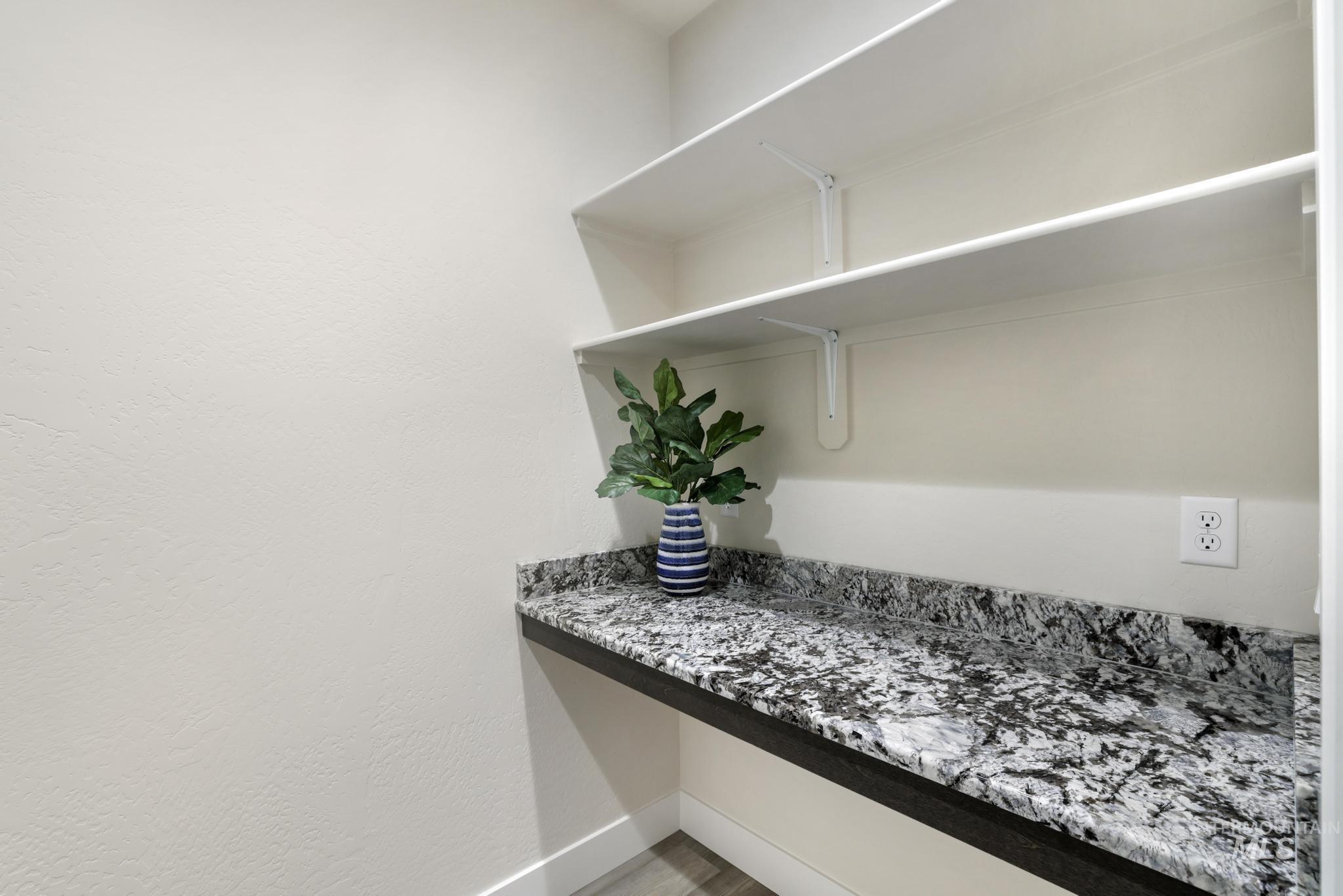 Detailed view of built in study area and baseboards
