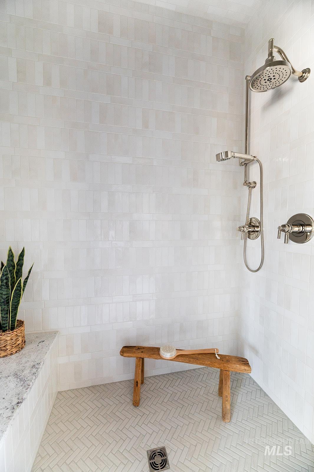 Bathroom featuring tiled shower