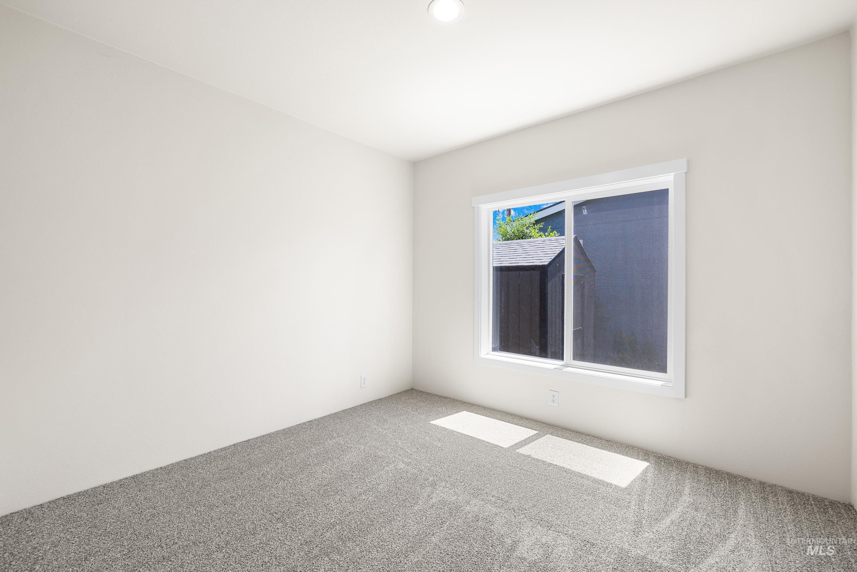 Unfurnished room featuring carpet and recessed lighting