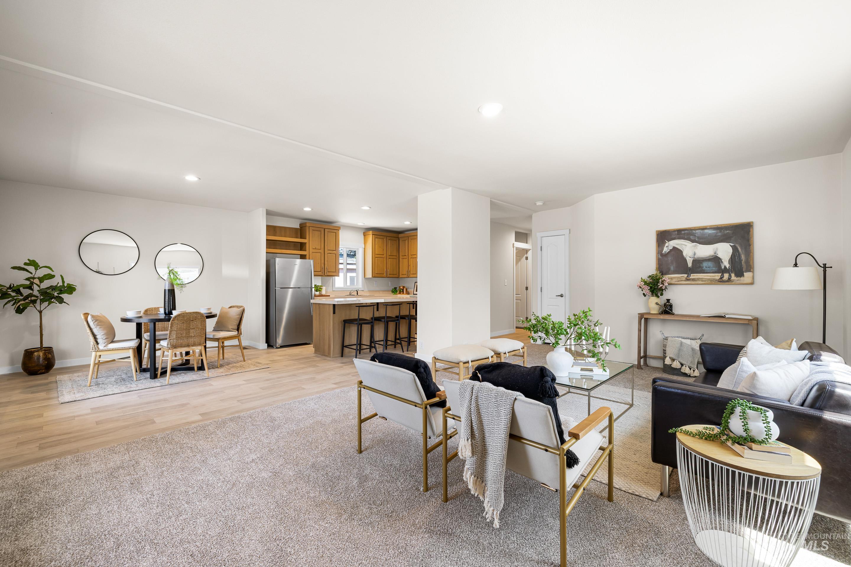 Living area featuring light wood-type flooring and recessed lighting