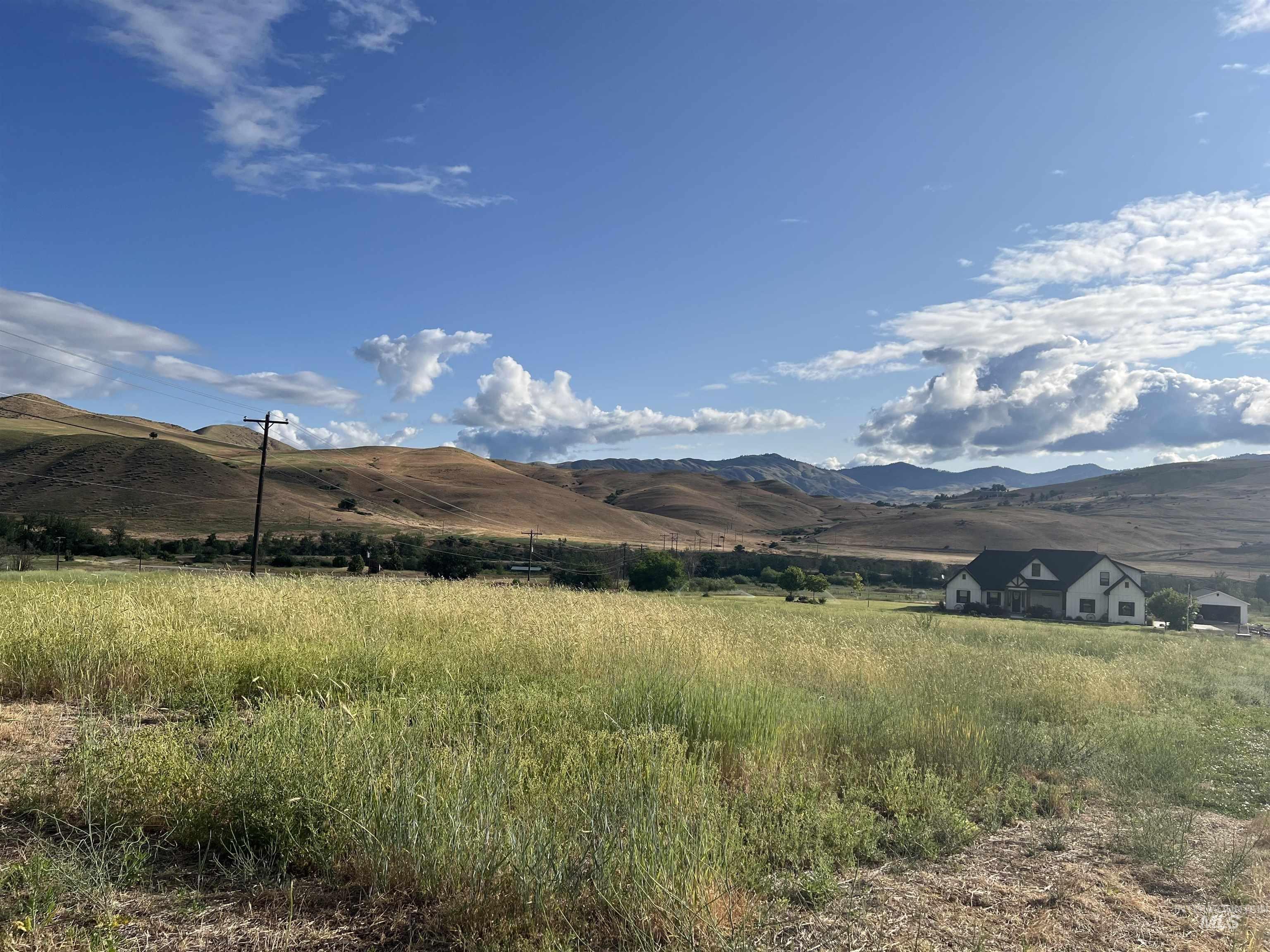 View of mountain backdrop with rural landscape