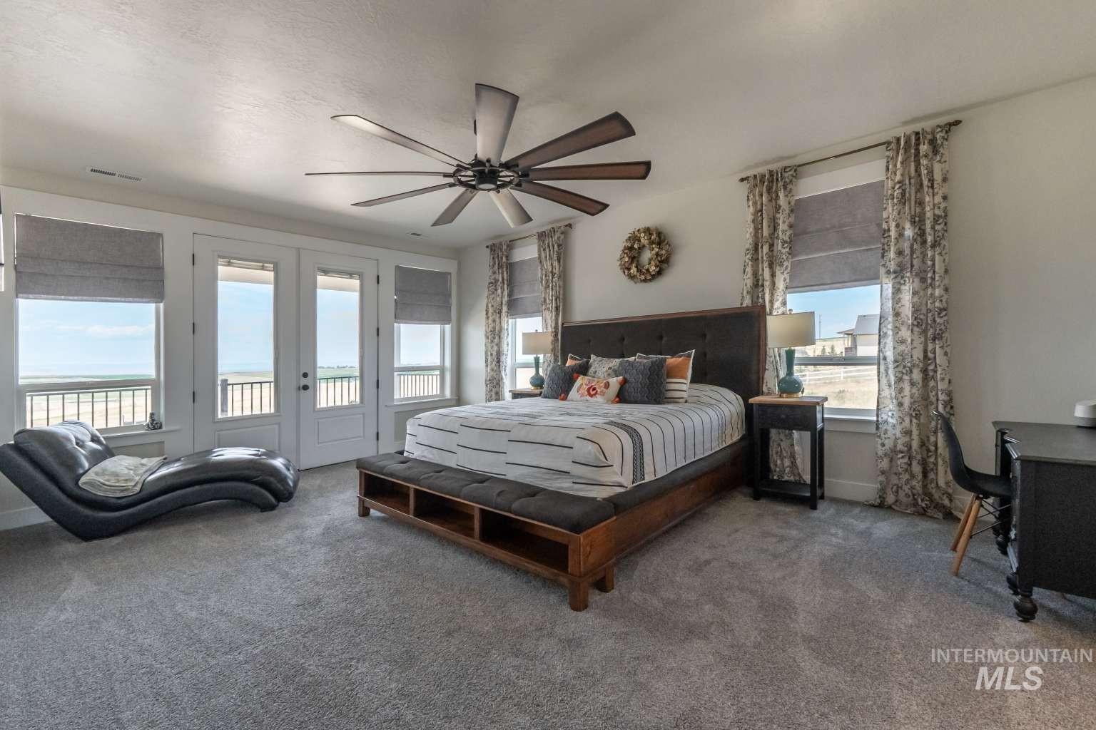 Bedroom featuring access to outside, carpet, a ceiling fan, and french doors