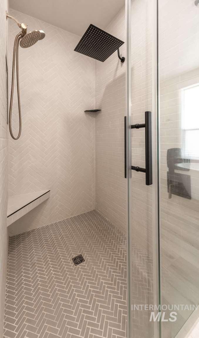 Full bath featuring a stall shower