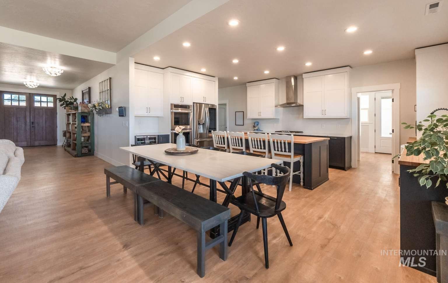 Dining space featuring light wood-style flooring and recessed lighting