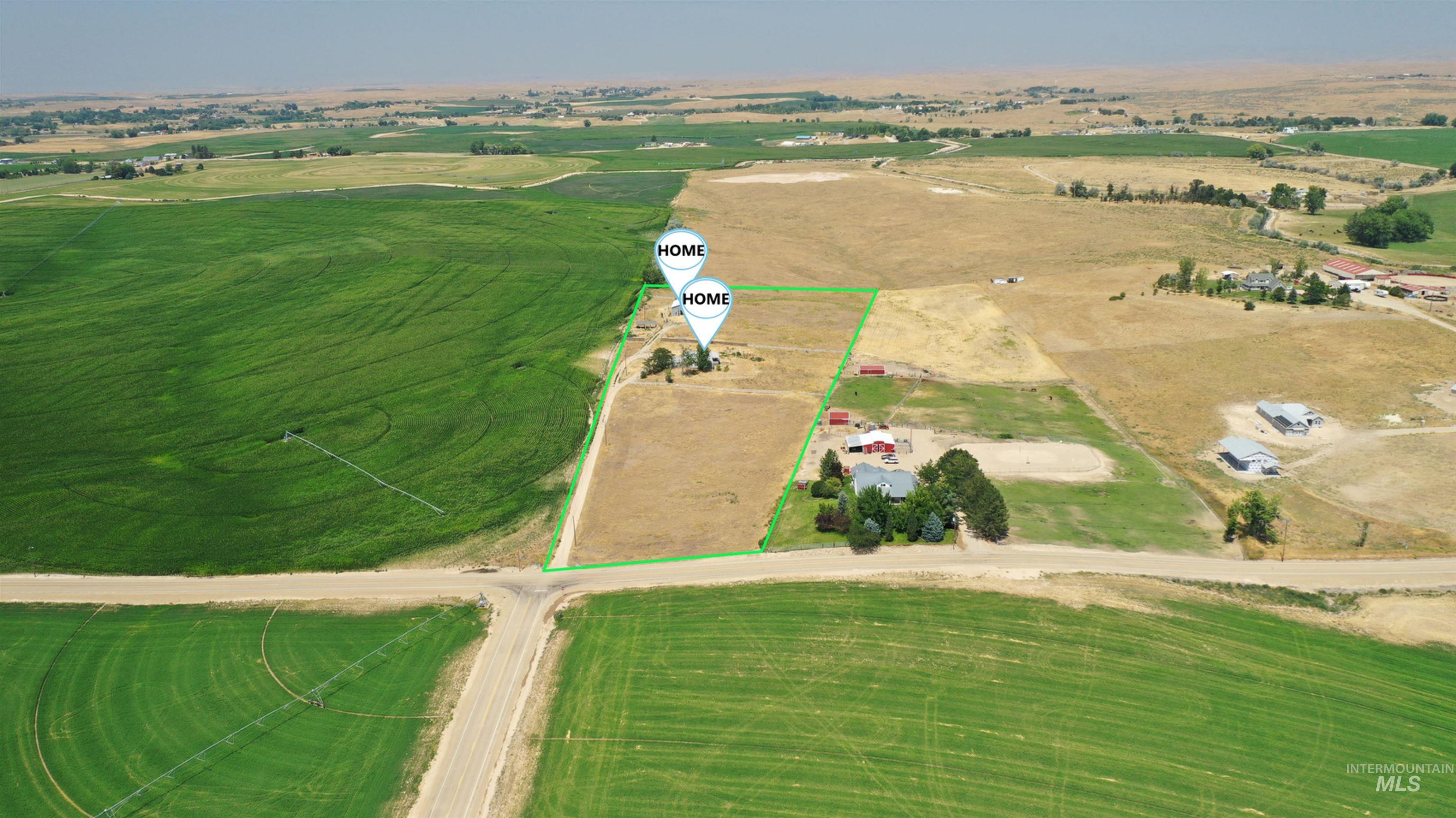 Aerial view of sparsely populated area featuring property parcel outlined