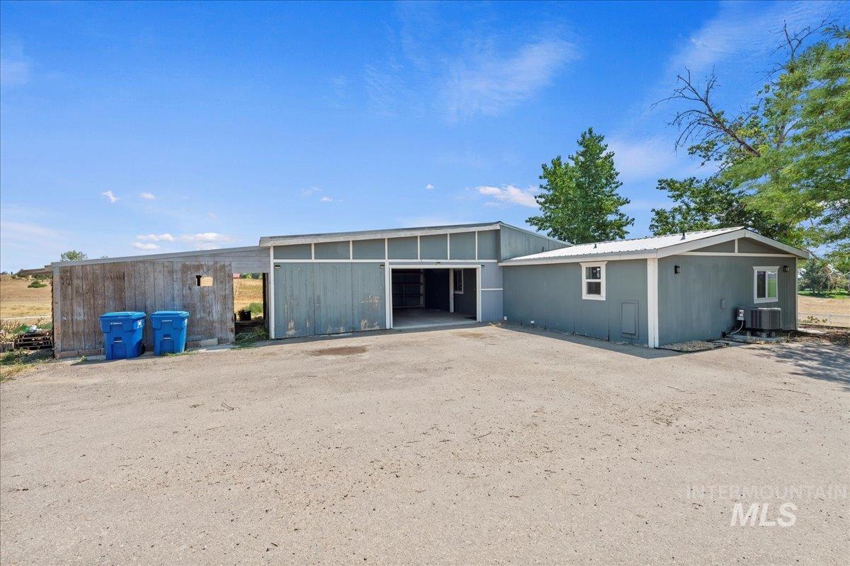 Back of house with attached garage