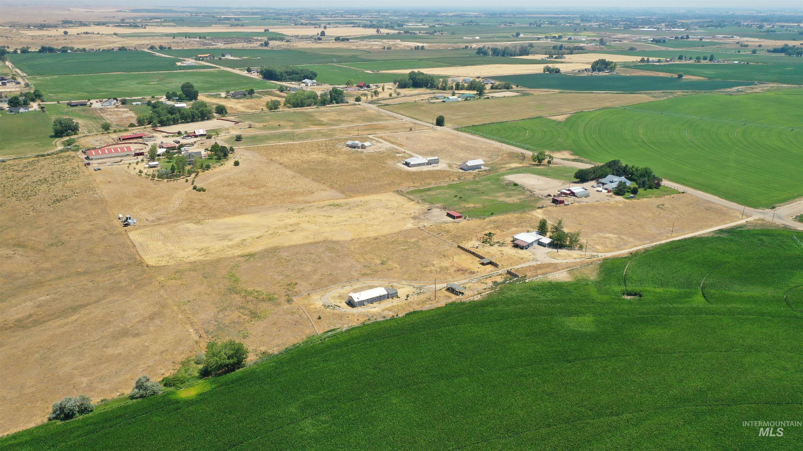 Aerial view of property and surrounding area with rural landscape