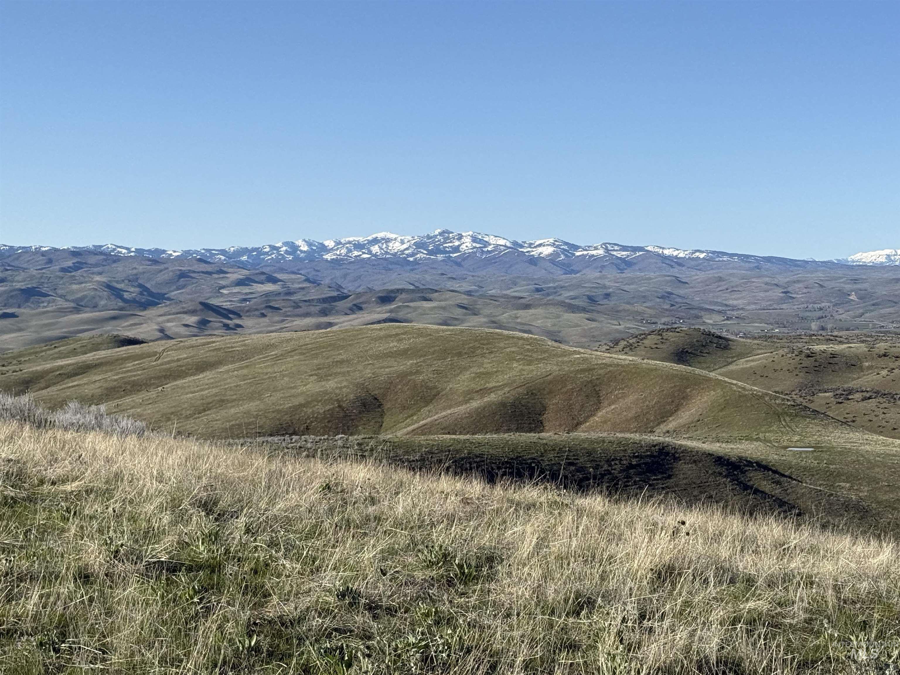 View of mountain backdrop featuring rural landscape