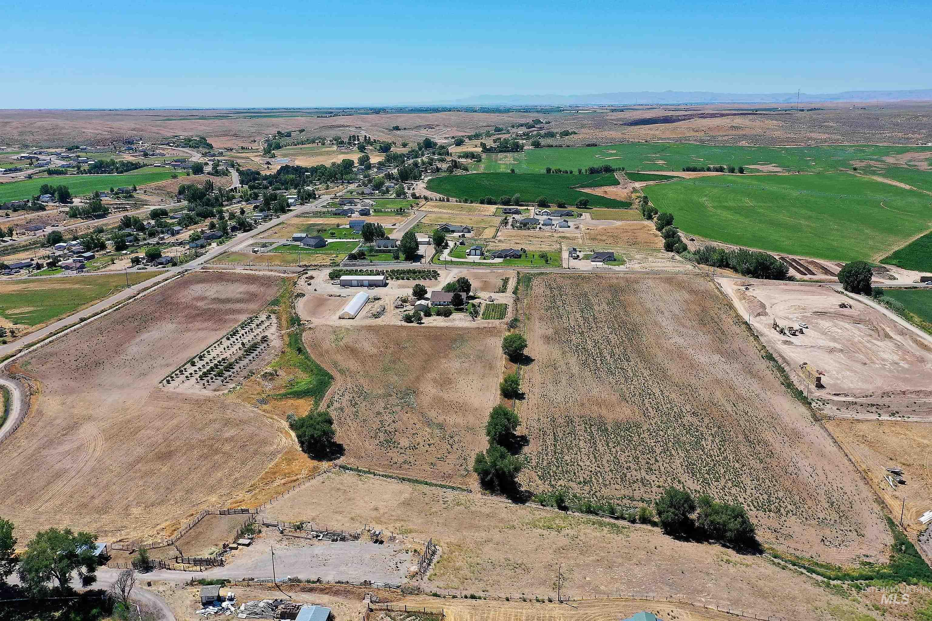 Aerial view of property and surrounding area with rural landscape