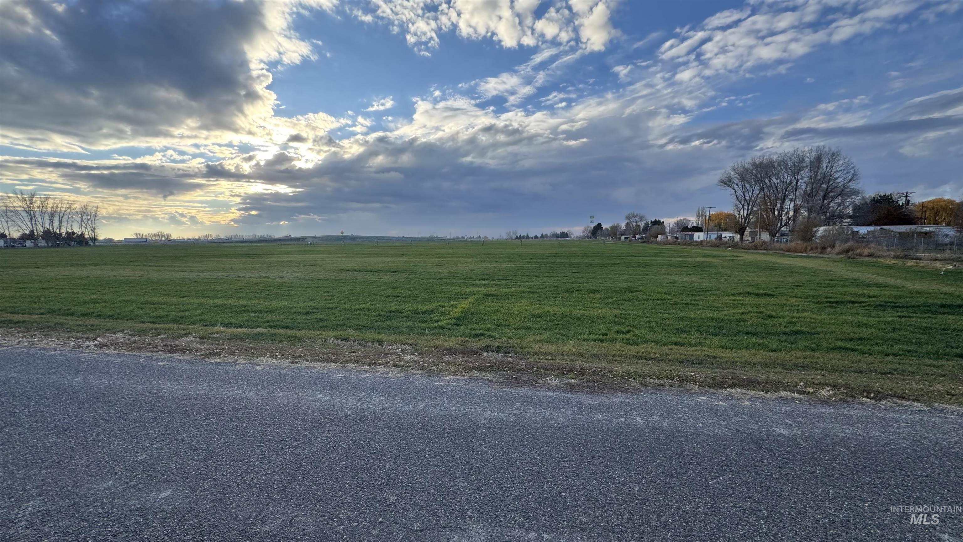 View of asphalt road with a view of countryside